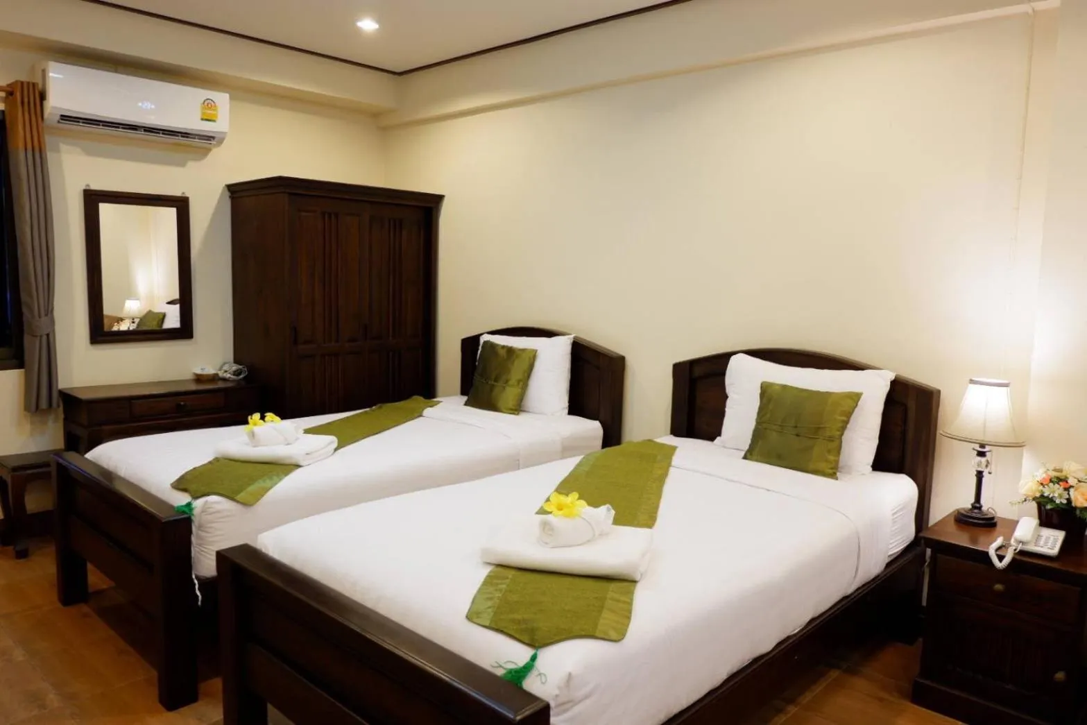 Bed in NanBaanKhun Hotel