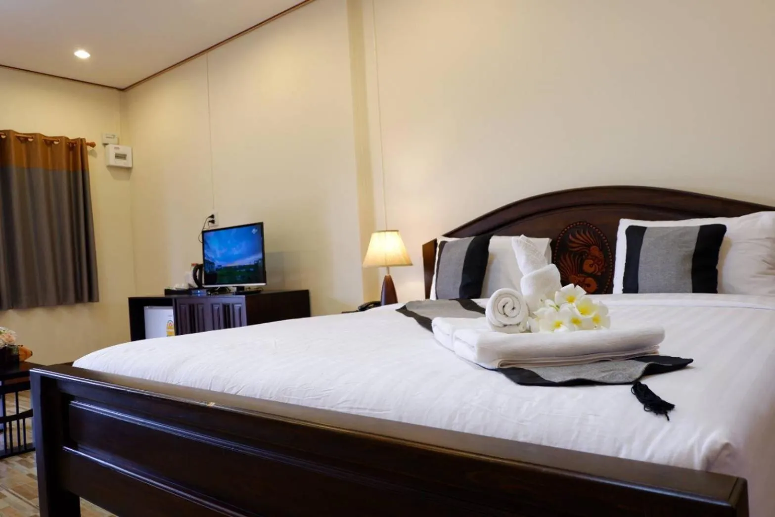 Bed in NanBaanKhun Hotel