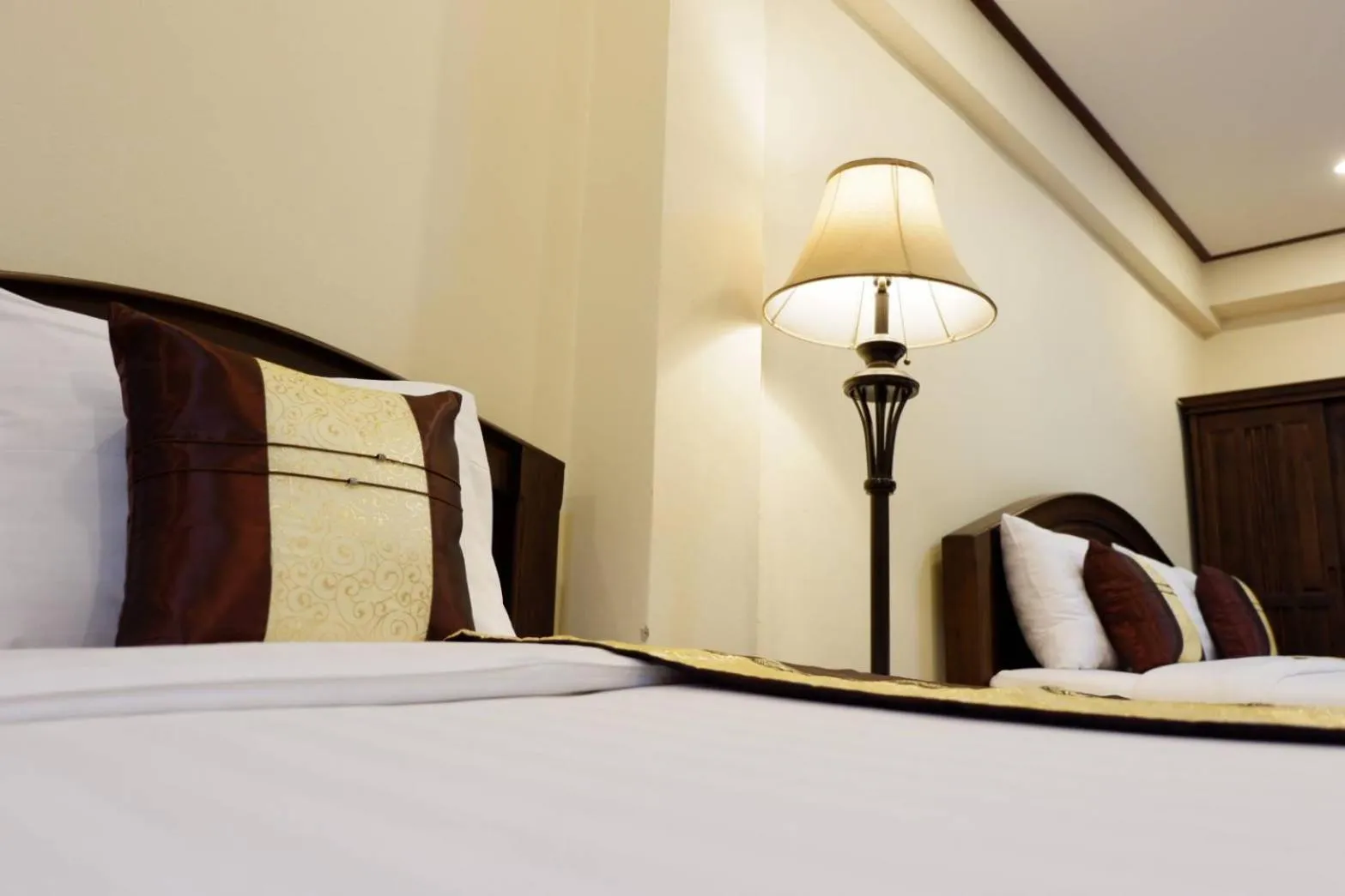 Bed in NanBaanKhun Hotel