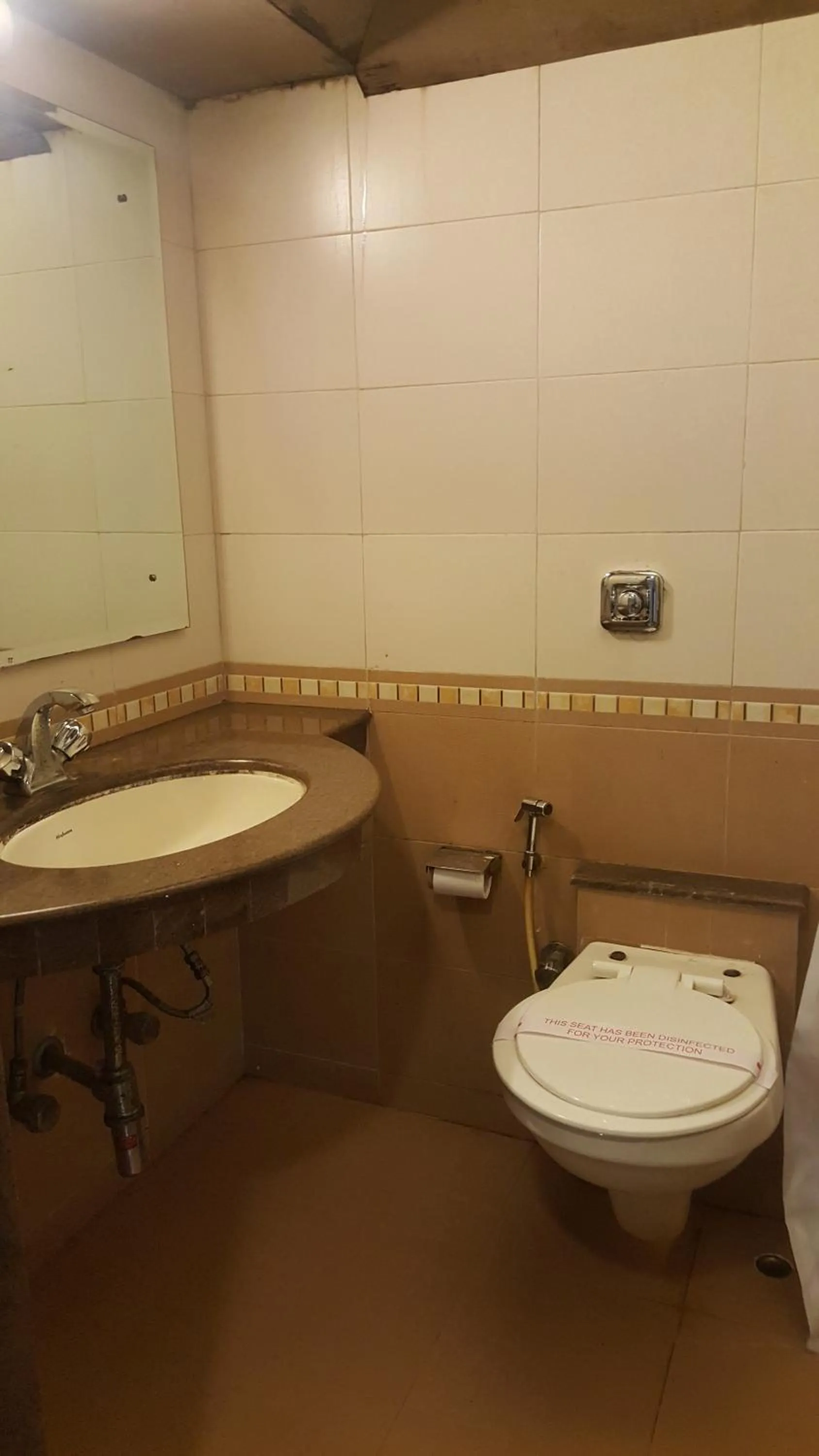 Toilet in Privilege Inn
