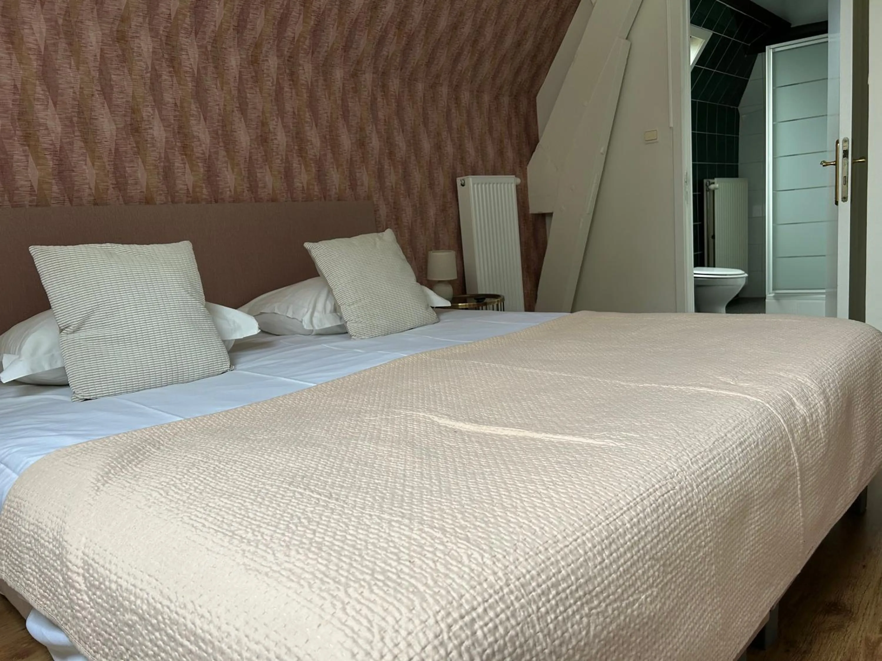 Bed in Hotel Vredehof