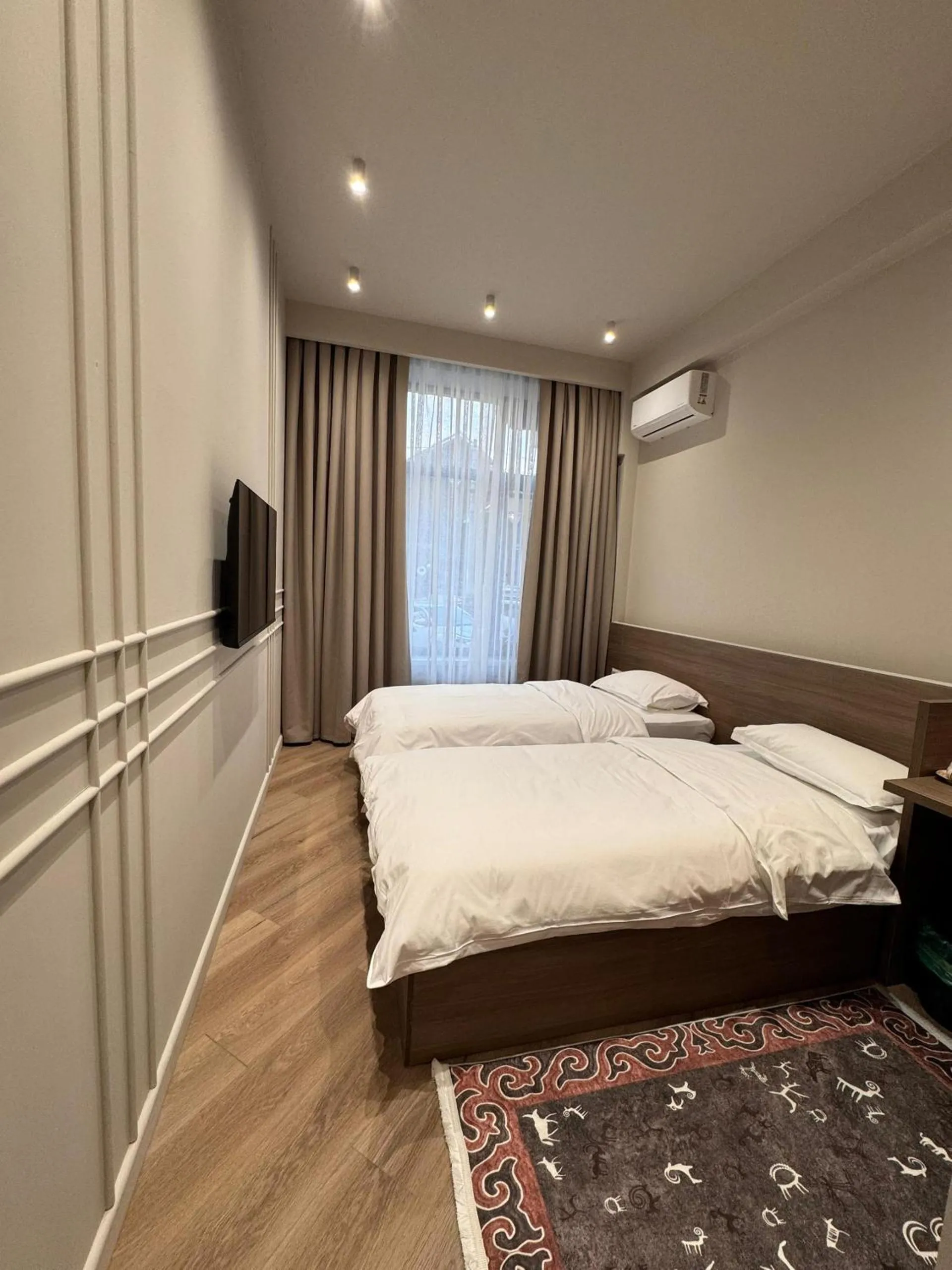 Bed in Bugu Hotel Bishkek