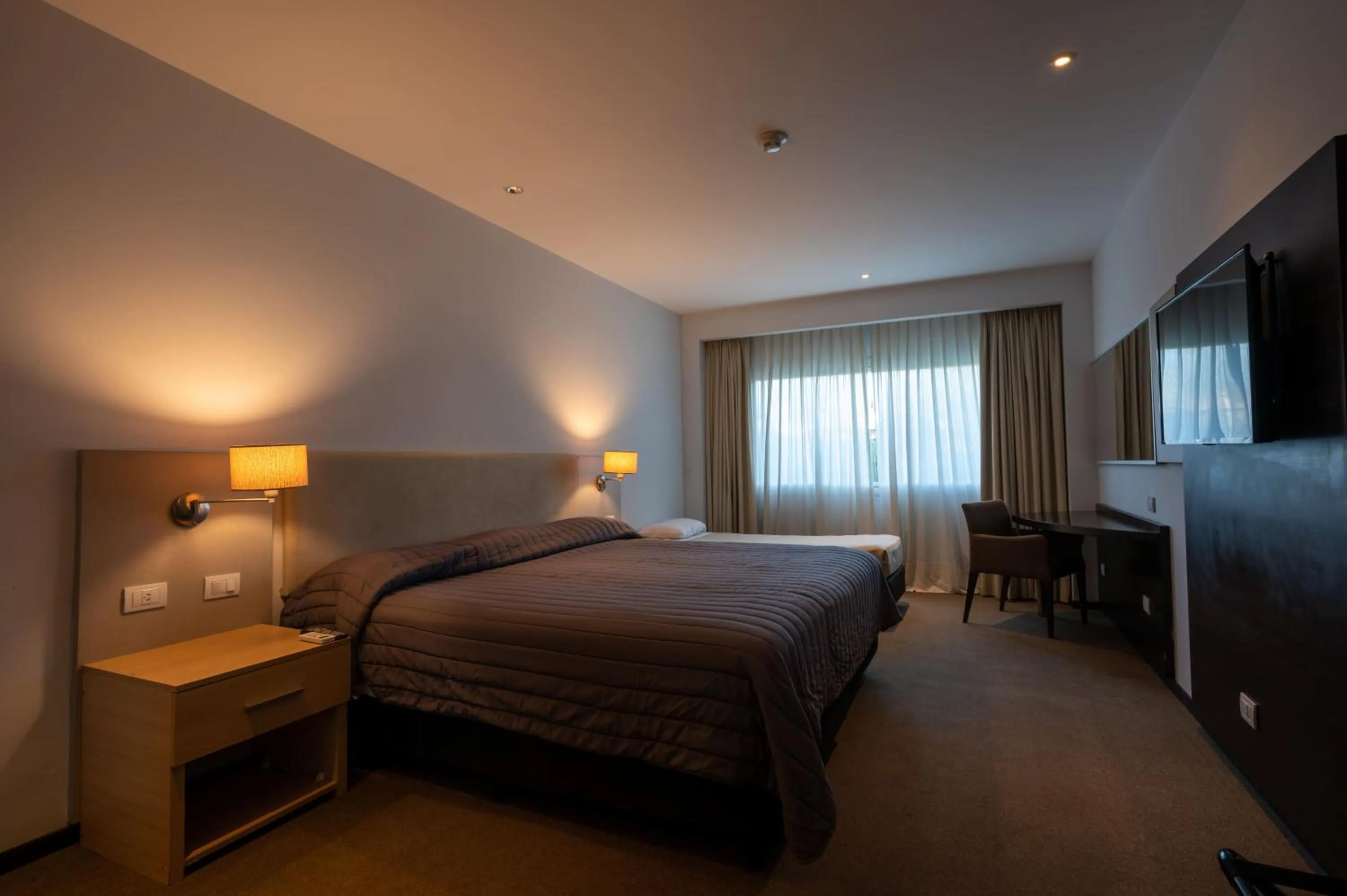 Bed in Howard Johnson Plaza Villa Carlos Paz