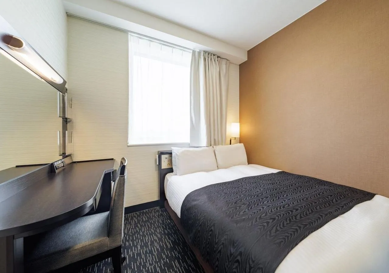 Bed in APA Hotel Miyazaki Nobeoka Chuo