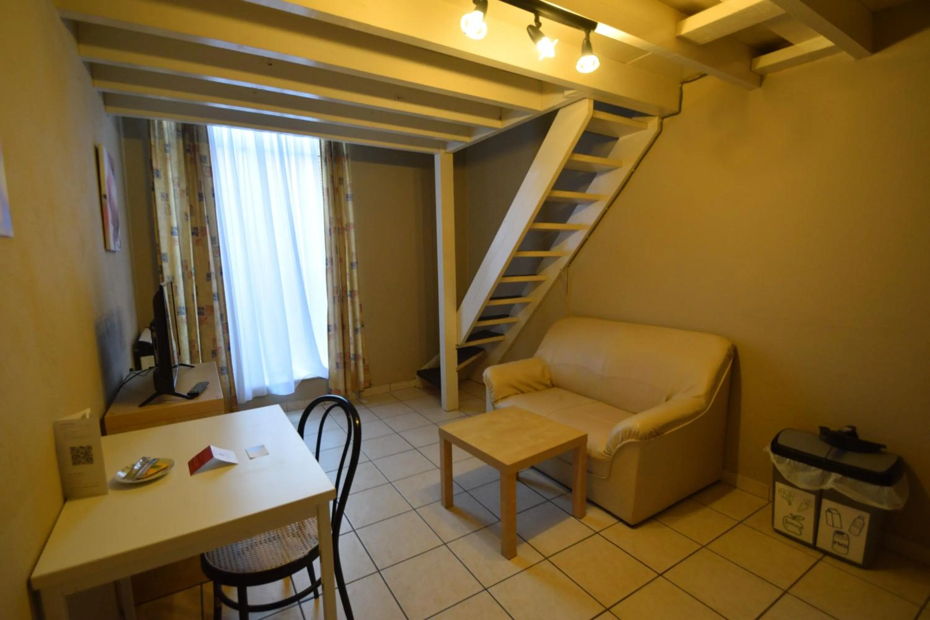 Seating area in Condo Gardens Leuven