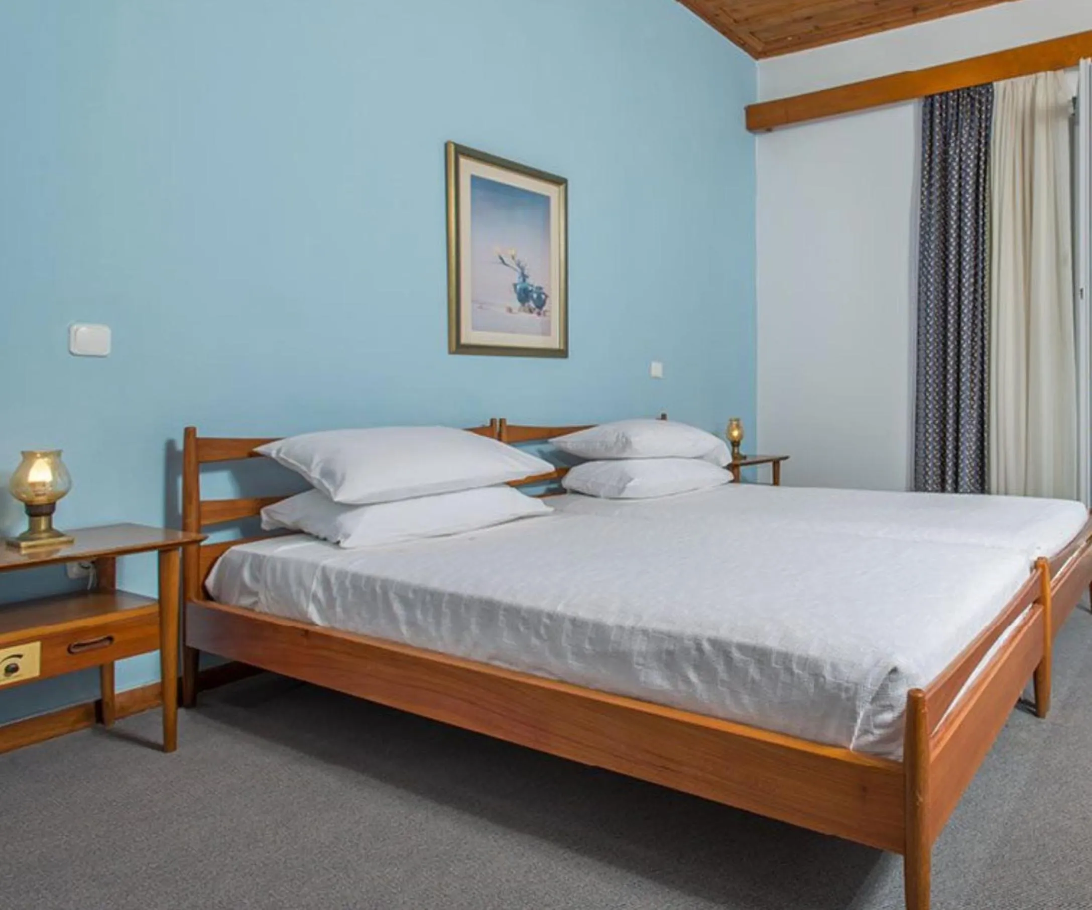 Bed in Delfinia Hotel & Bungalows