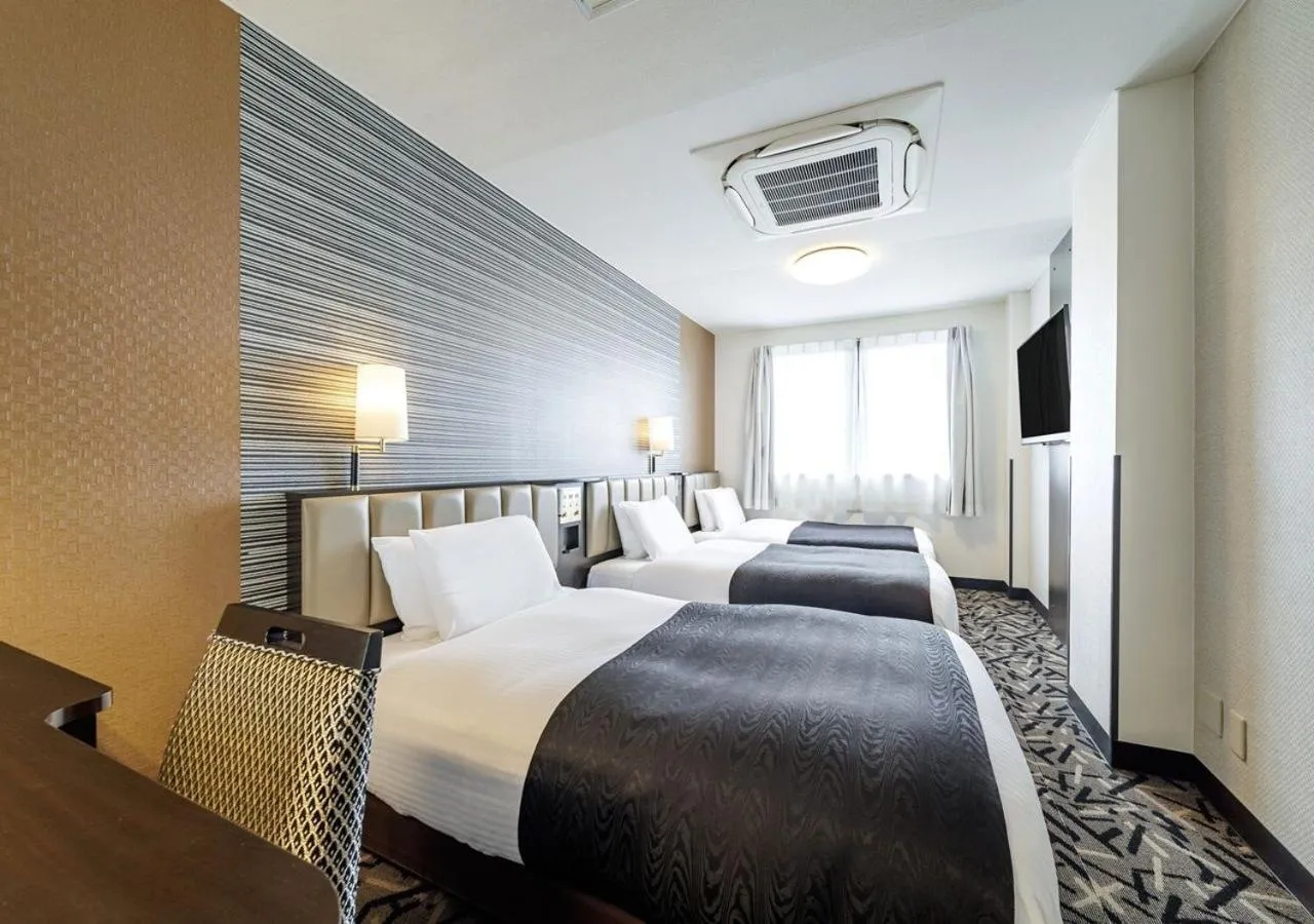 Photo of the whole room, Bed in APA Hotel Miyazaki Nobeoka Ekimae