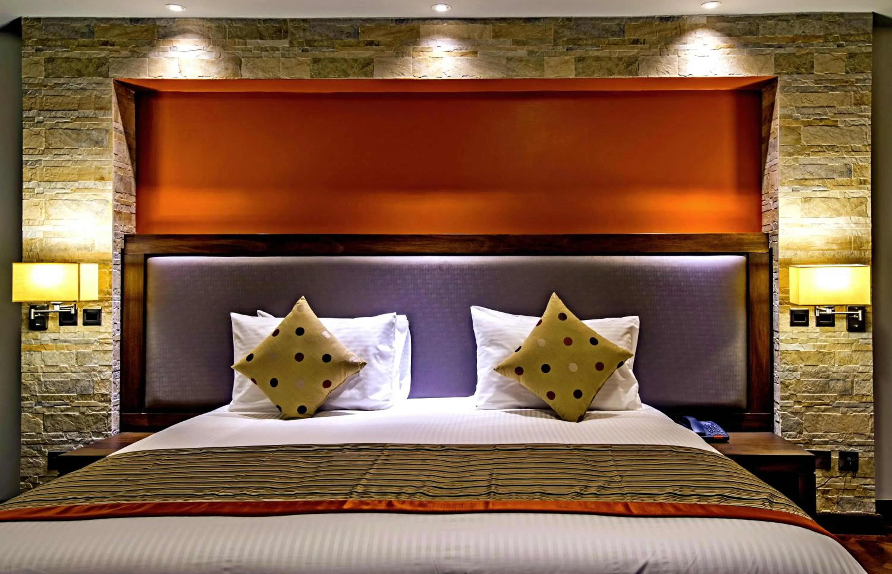 Bed in Magna Hotel and Suites