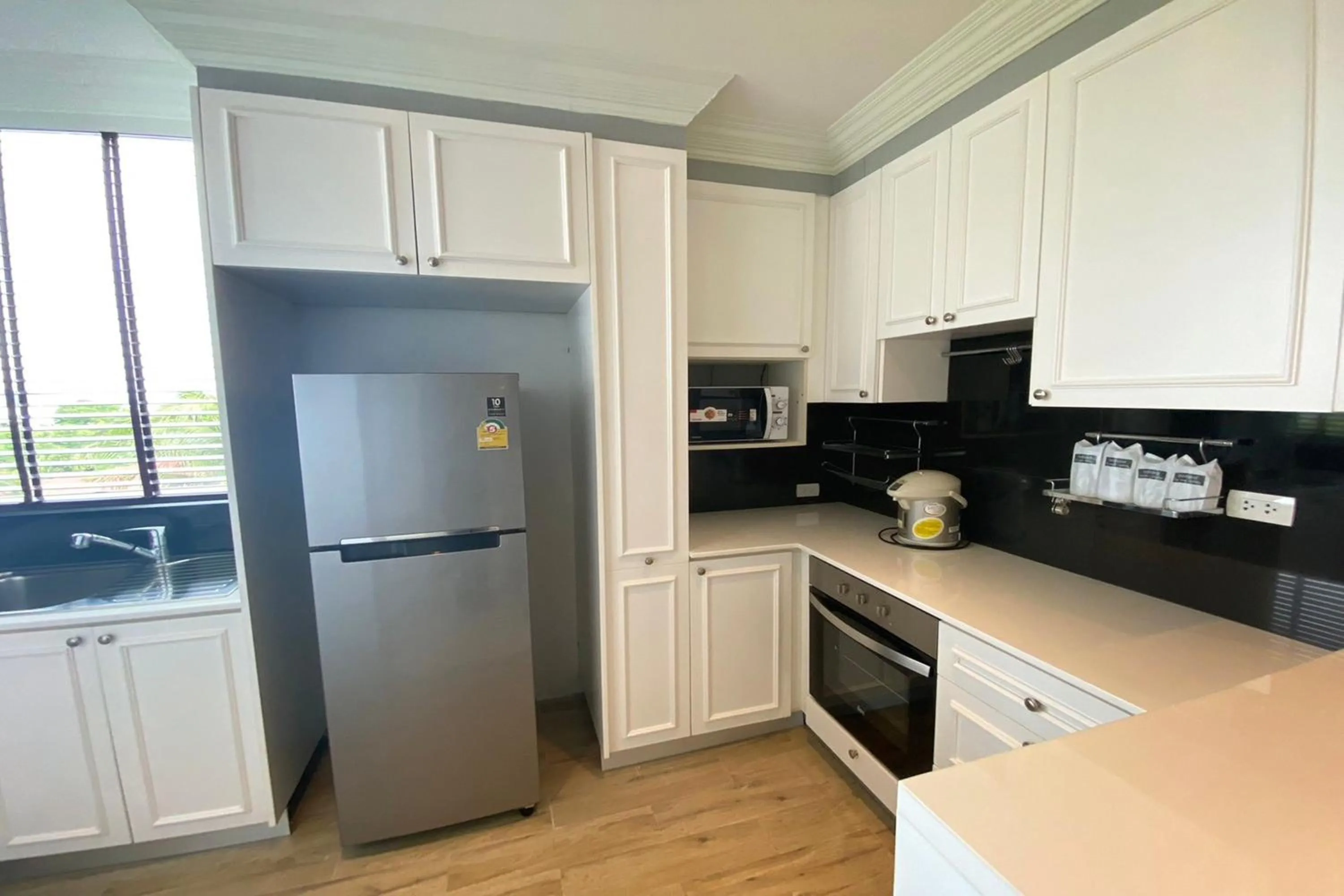 Kitchen or kitchenette in Aqua Resort Phuket - Near Beach and Chalong Pier