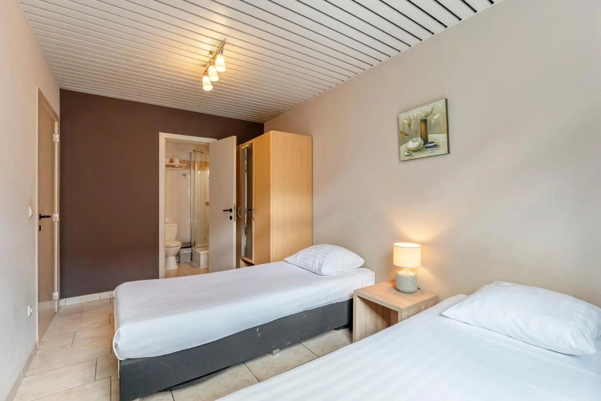 Bed in Condo Gardens Brussels