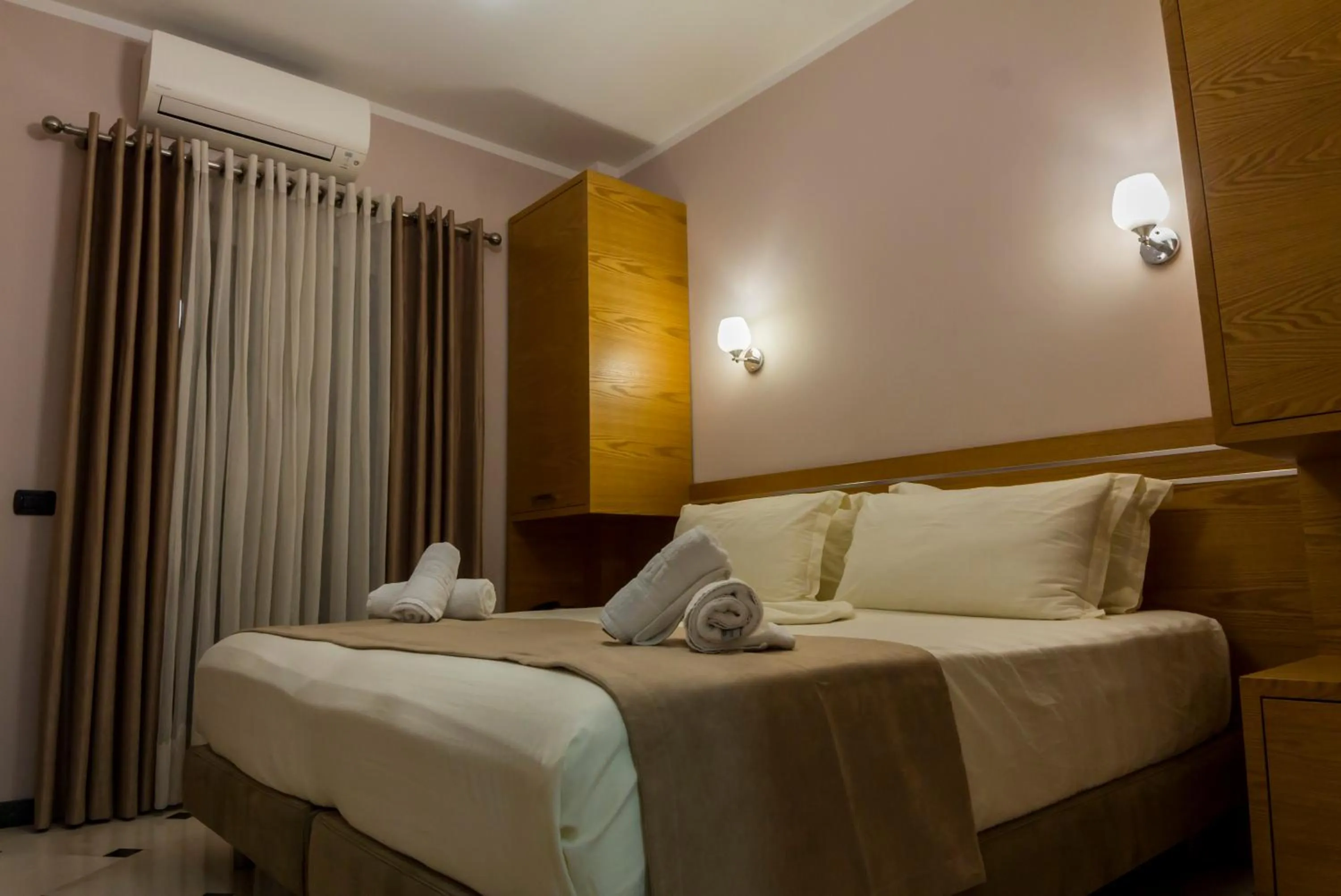 Bed in Hotel Pandora Residence