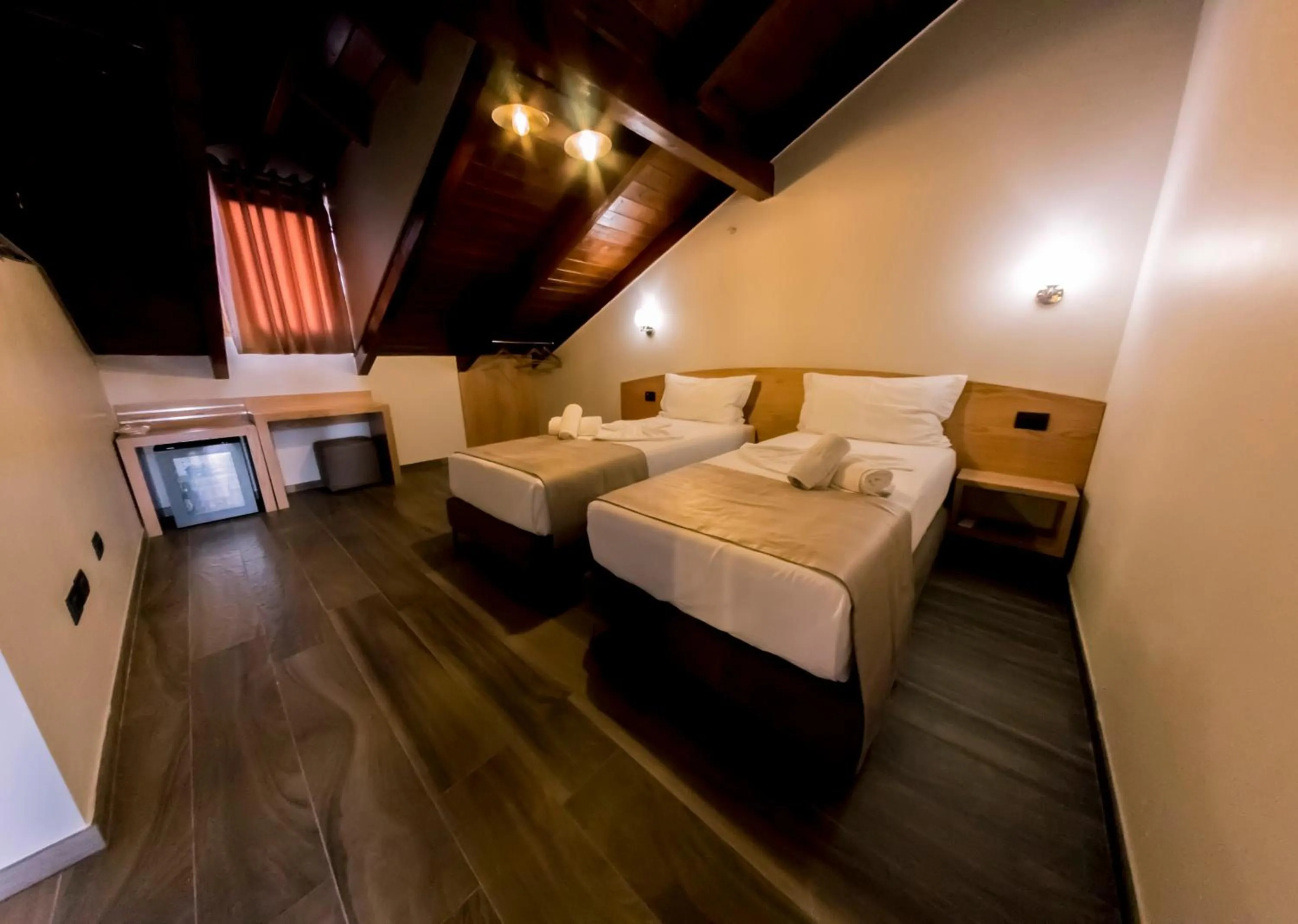 Bed in Hotel Pandora Residence