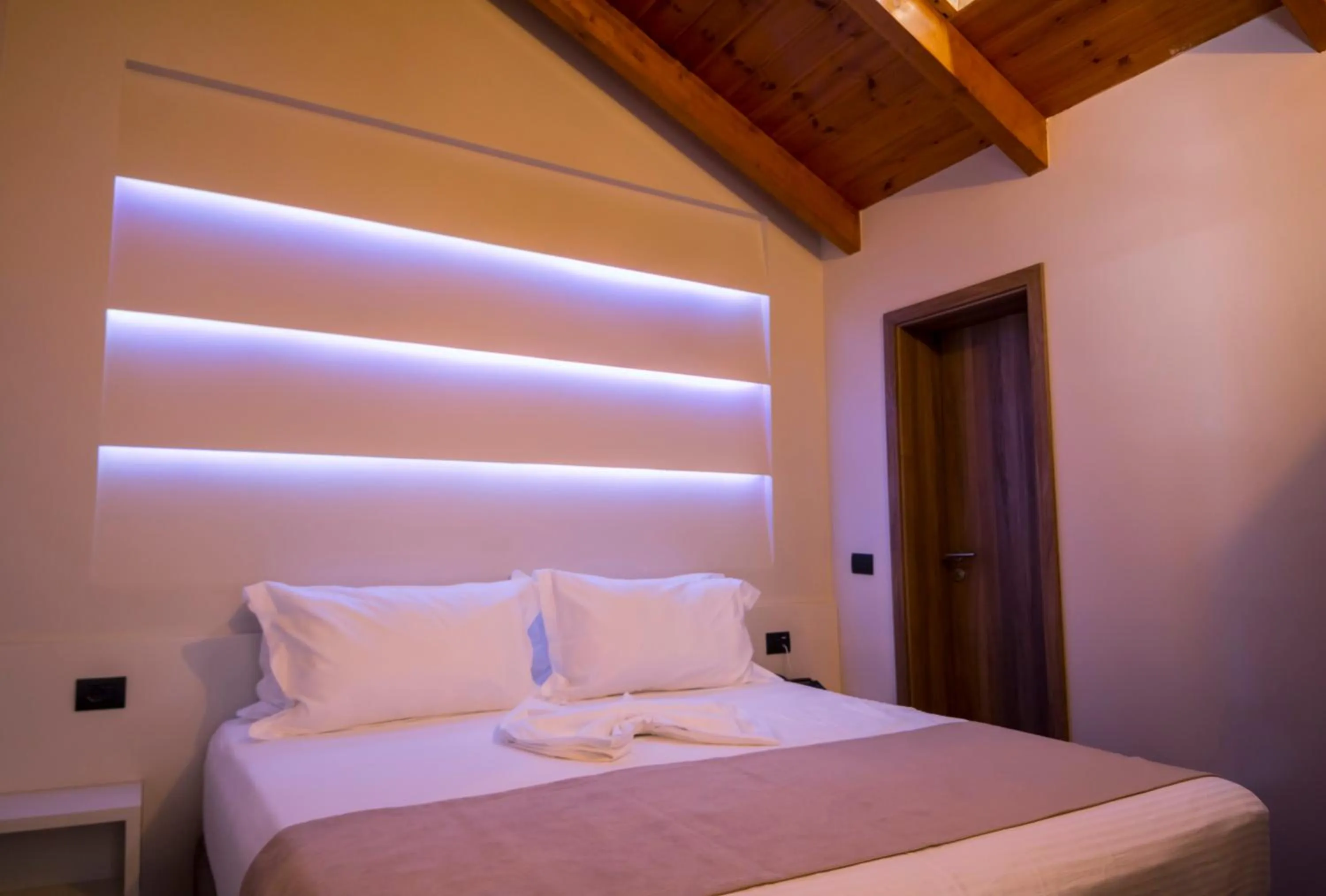 Bed in Hotel Pandora Residence