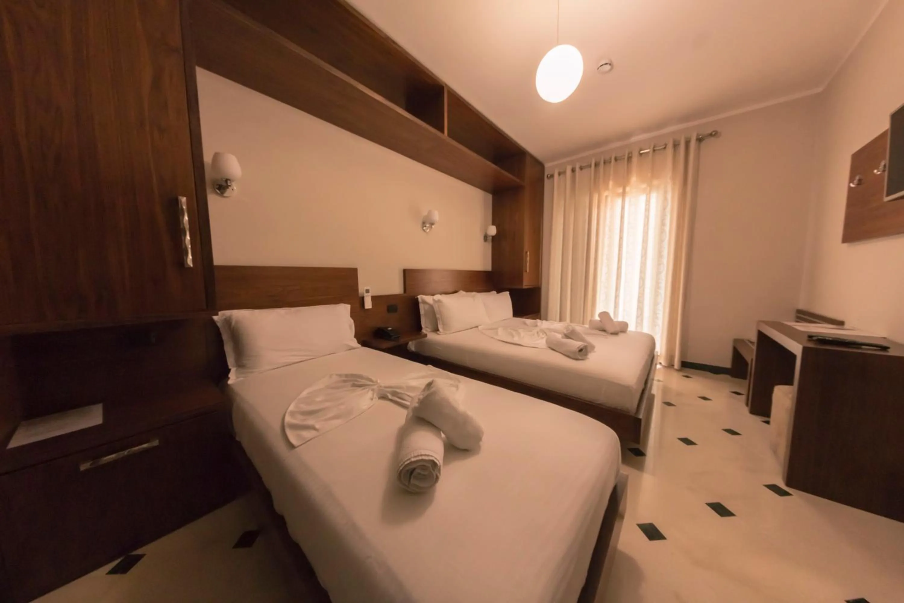 Bed in Hotel Pandora Residence