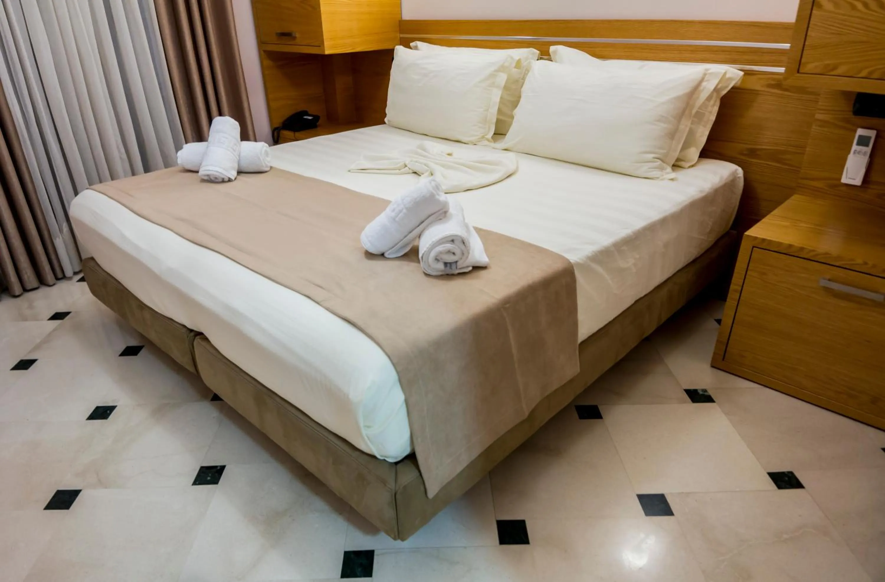 Bed in Hotel Pandora Residence