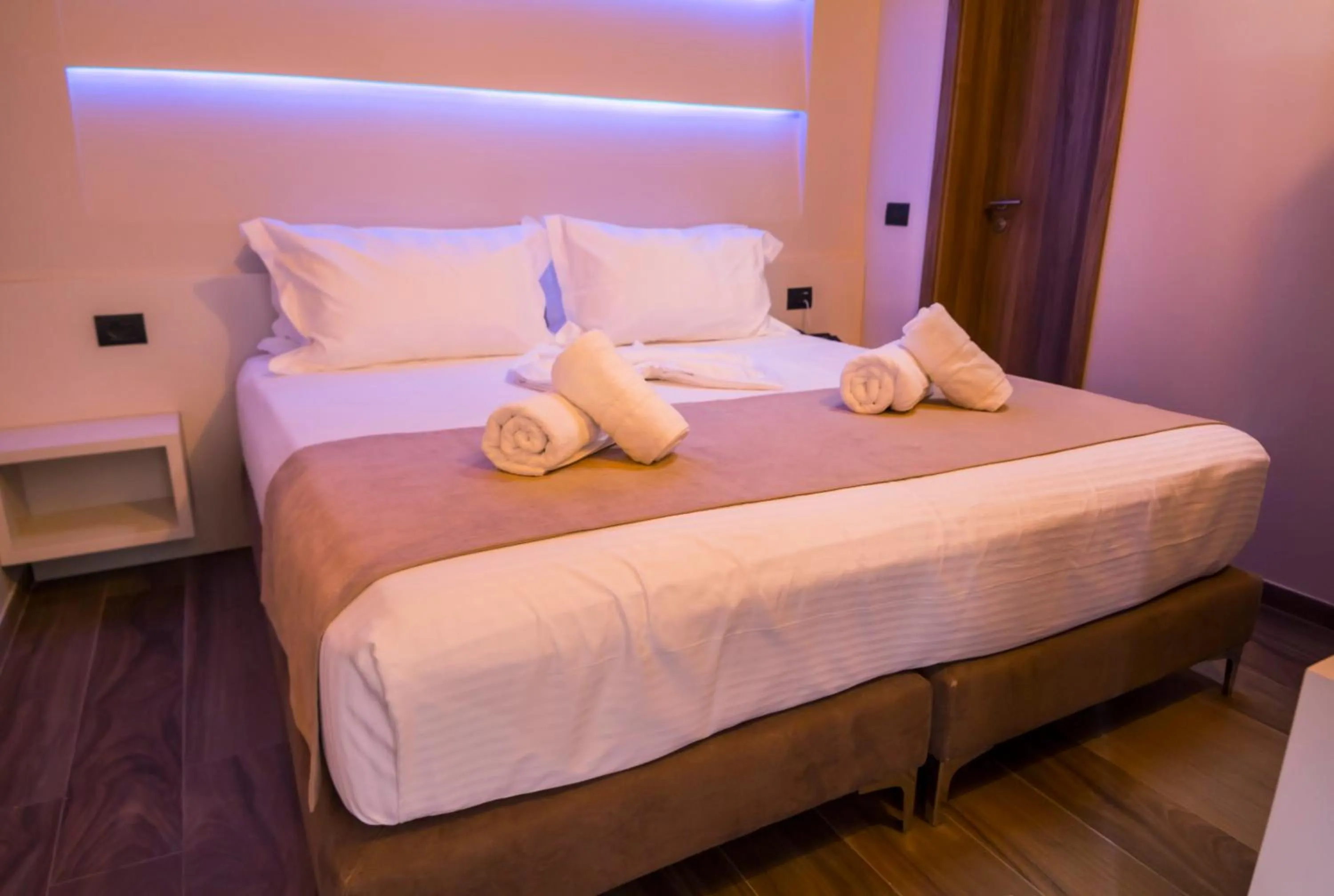 Bed in Hotel Pandora Residence