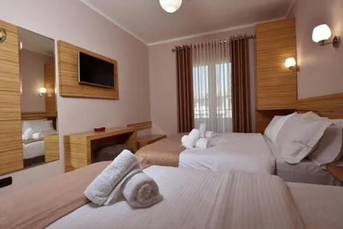 Bed in Hotel Pandora Residence