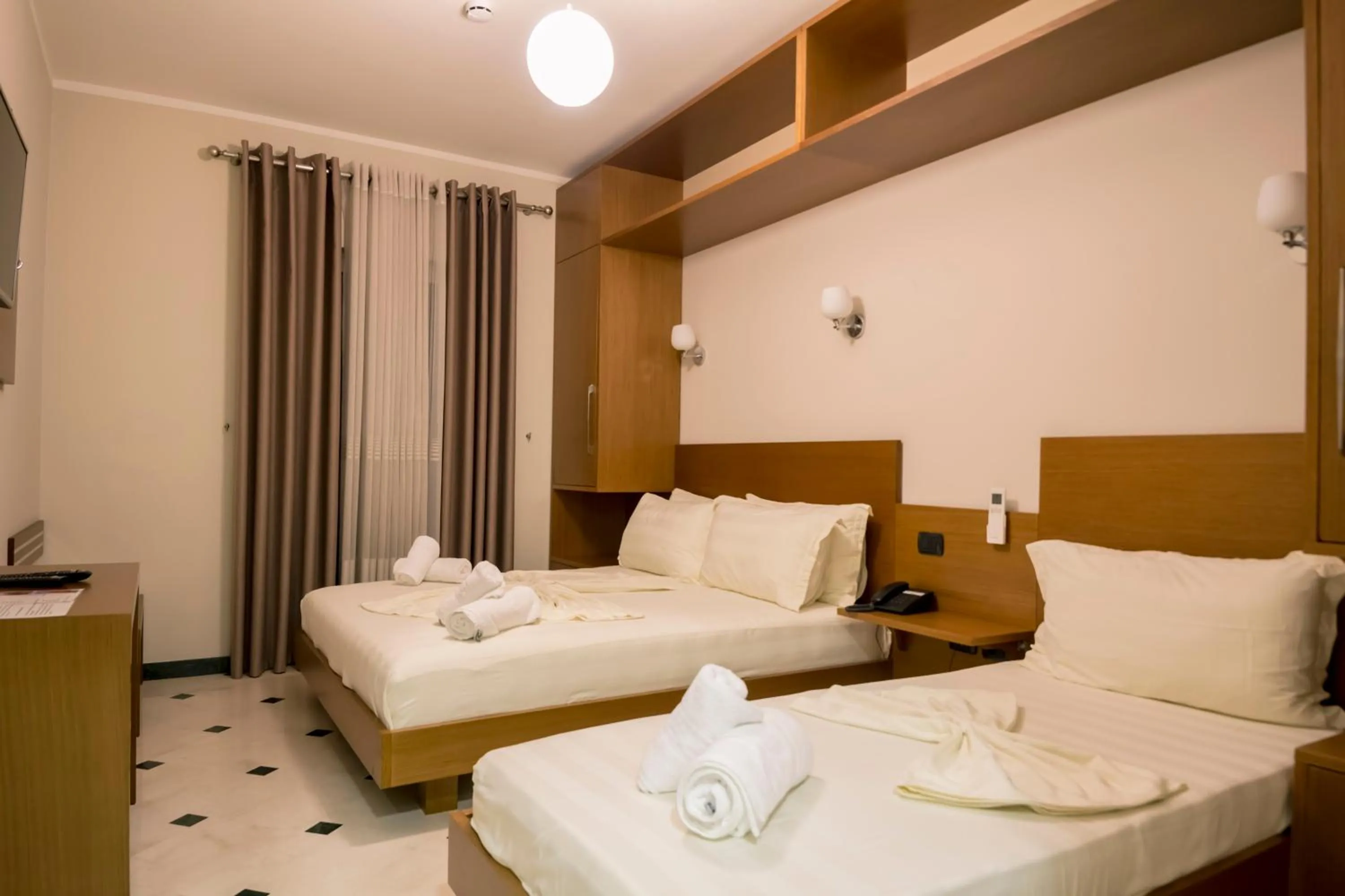 Bed in Hotel Pandora Residence