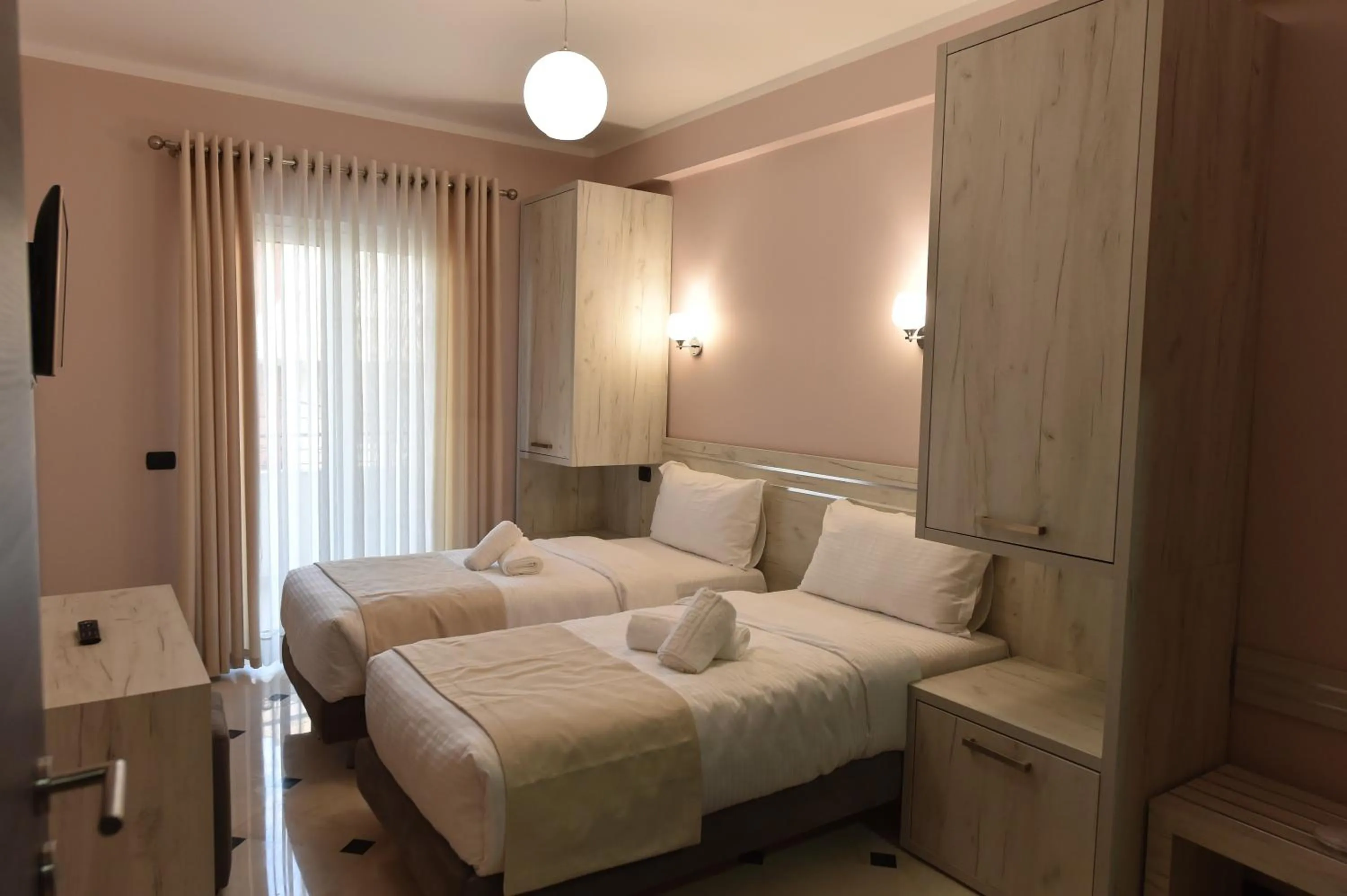 Bed in Hotel Pandora Residence