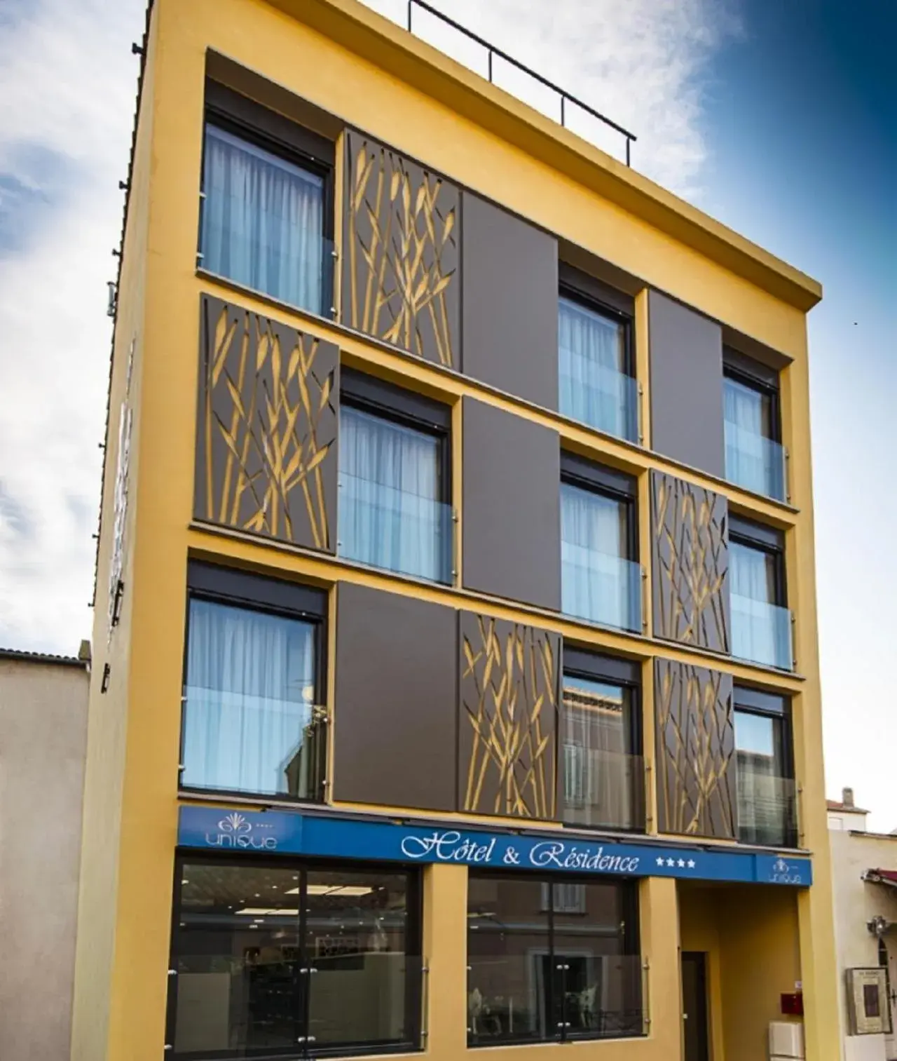 Property building in Unique Hôtel Résidence & Spa Property building in Unique Hôtel Résidence & Spa