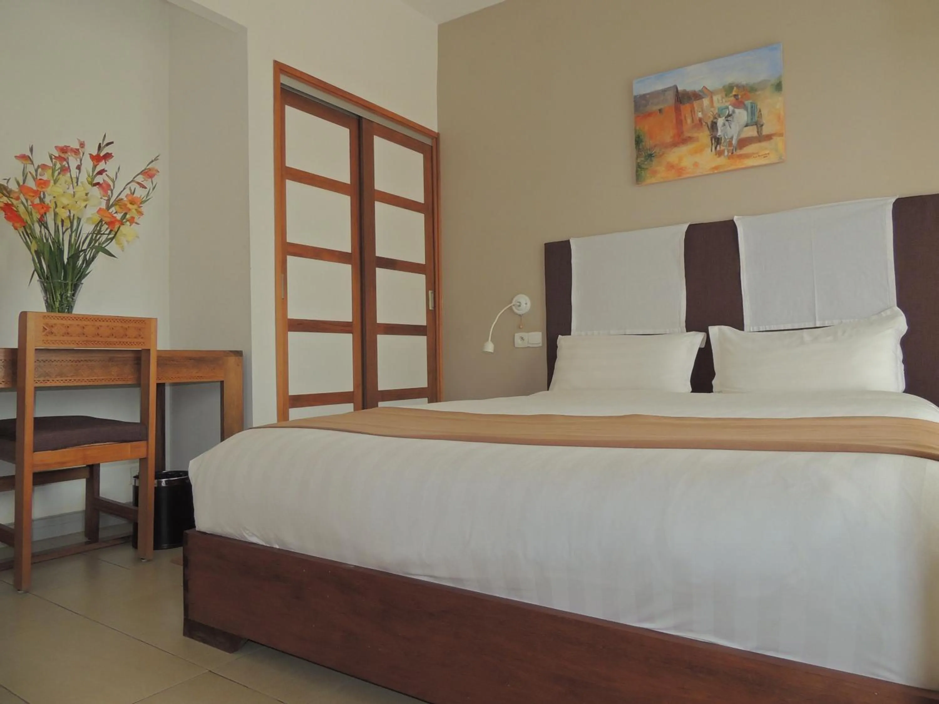 Bed in Plumeria Hotel