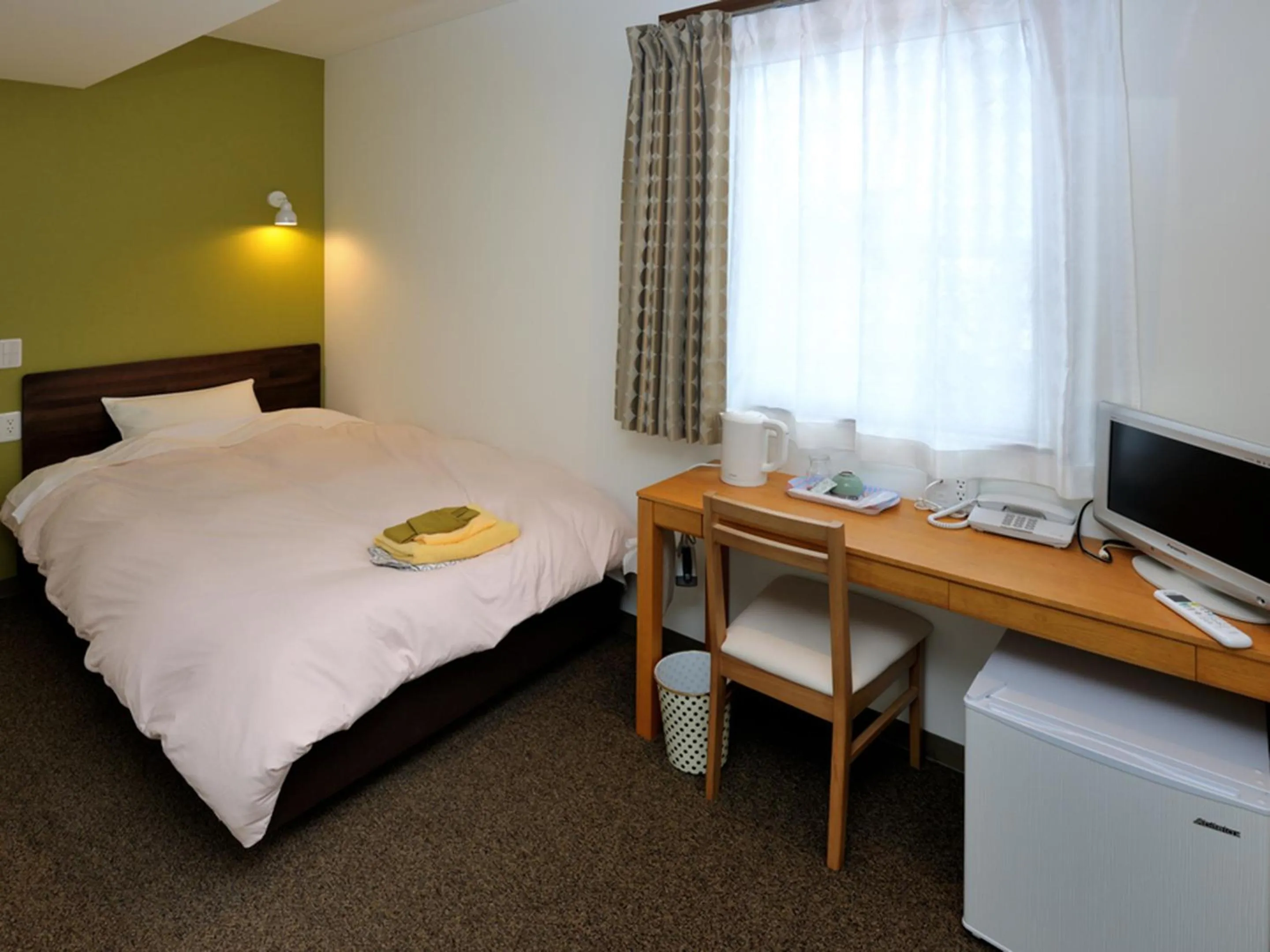 Bed in Kumagaya Royal Hotel Suzuki