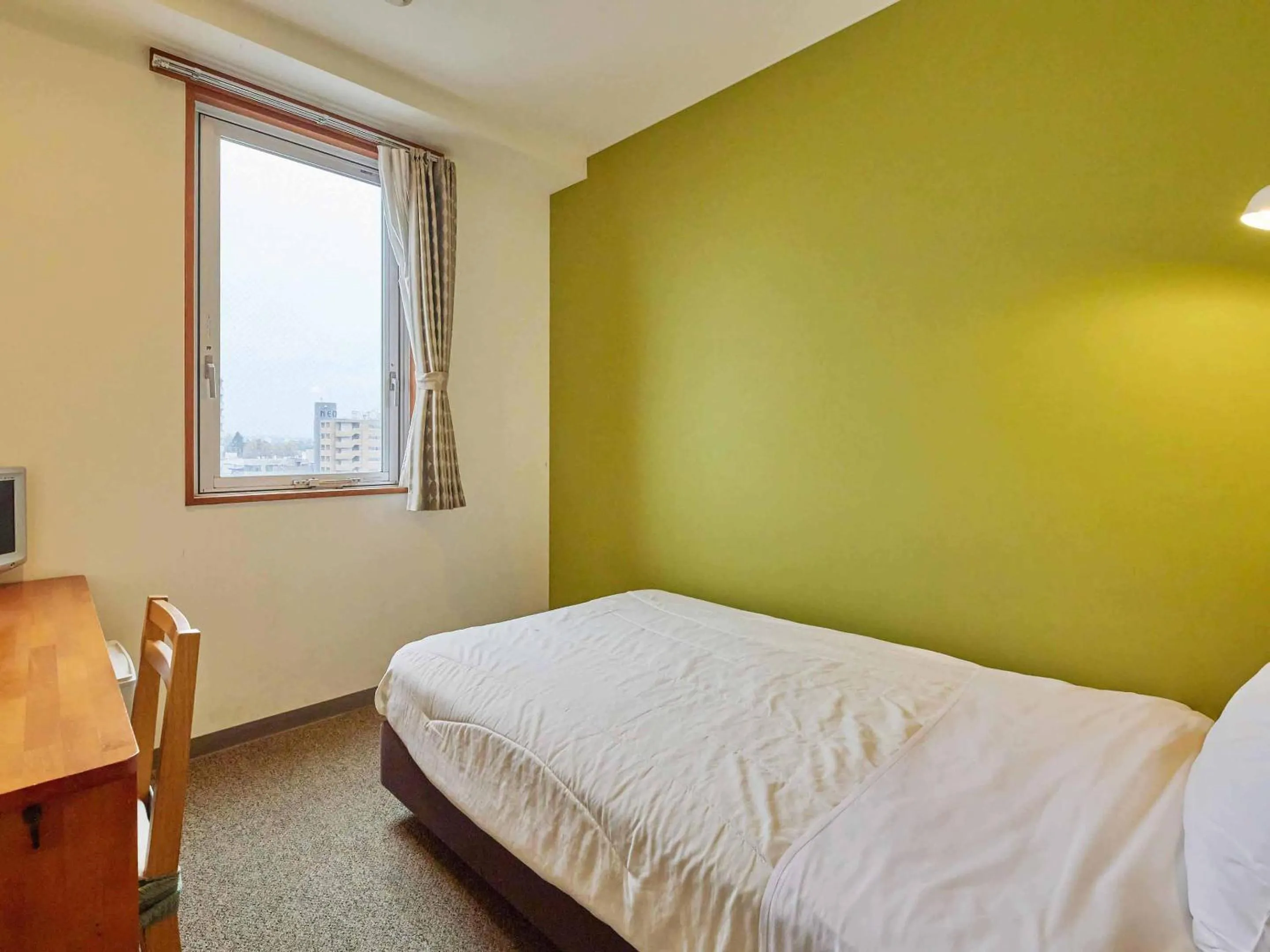 Bed in Kumagaya Royal Hotel Suzuki