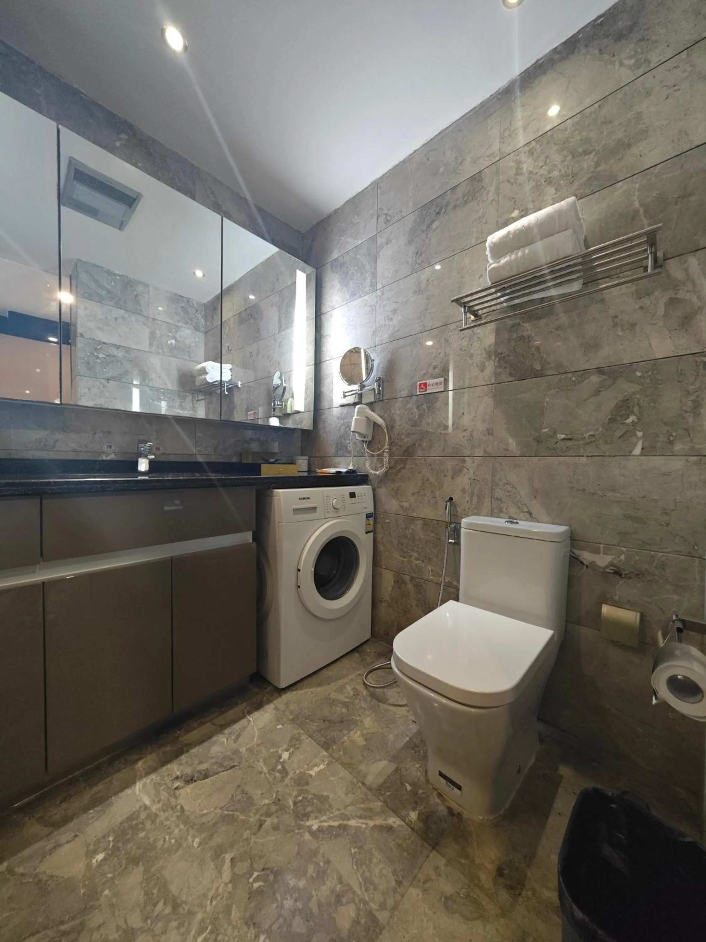 Bathroom in Green Lemon Tree International Apartment - Beijing Road Jiedeng Metropolis Branch