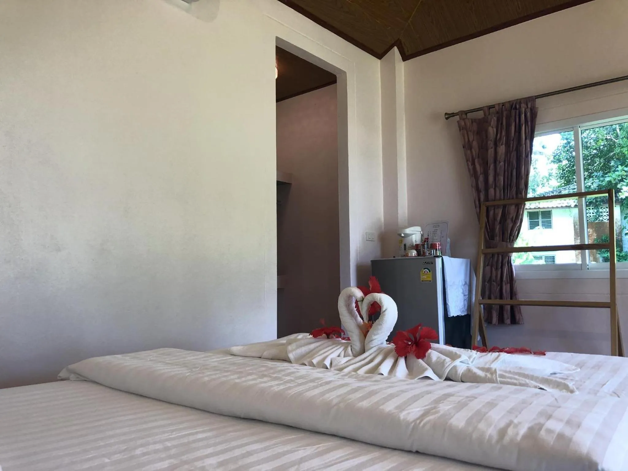 Bed in Prompakdee Kohmak Resort