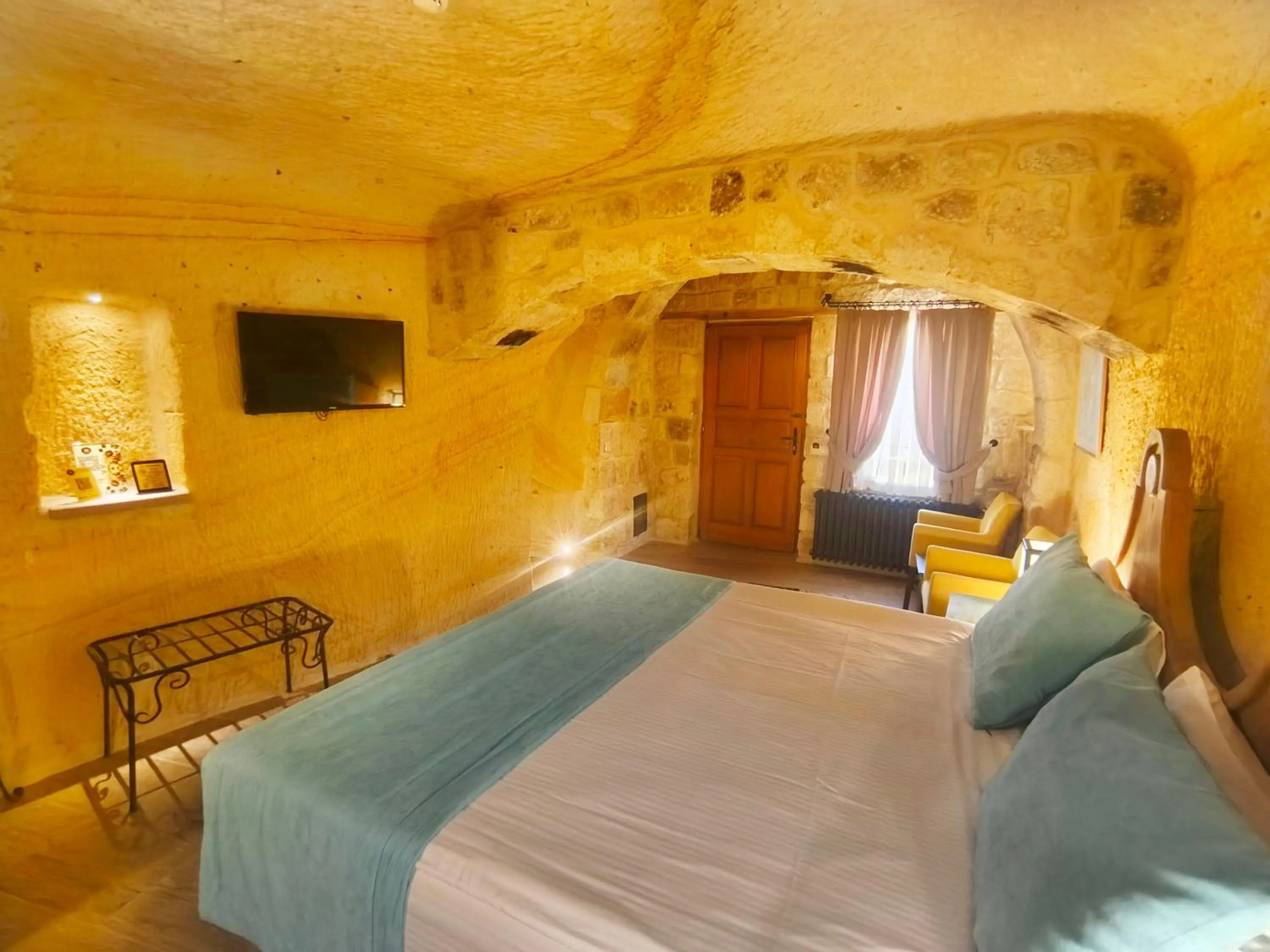 Bed in Acropolis Cave Suite