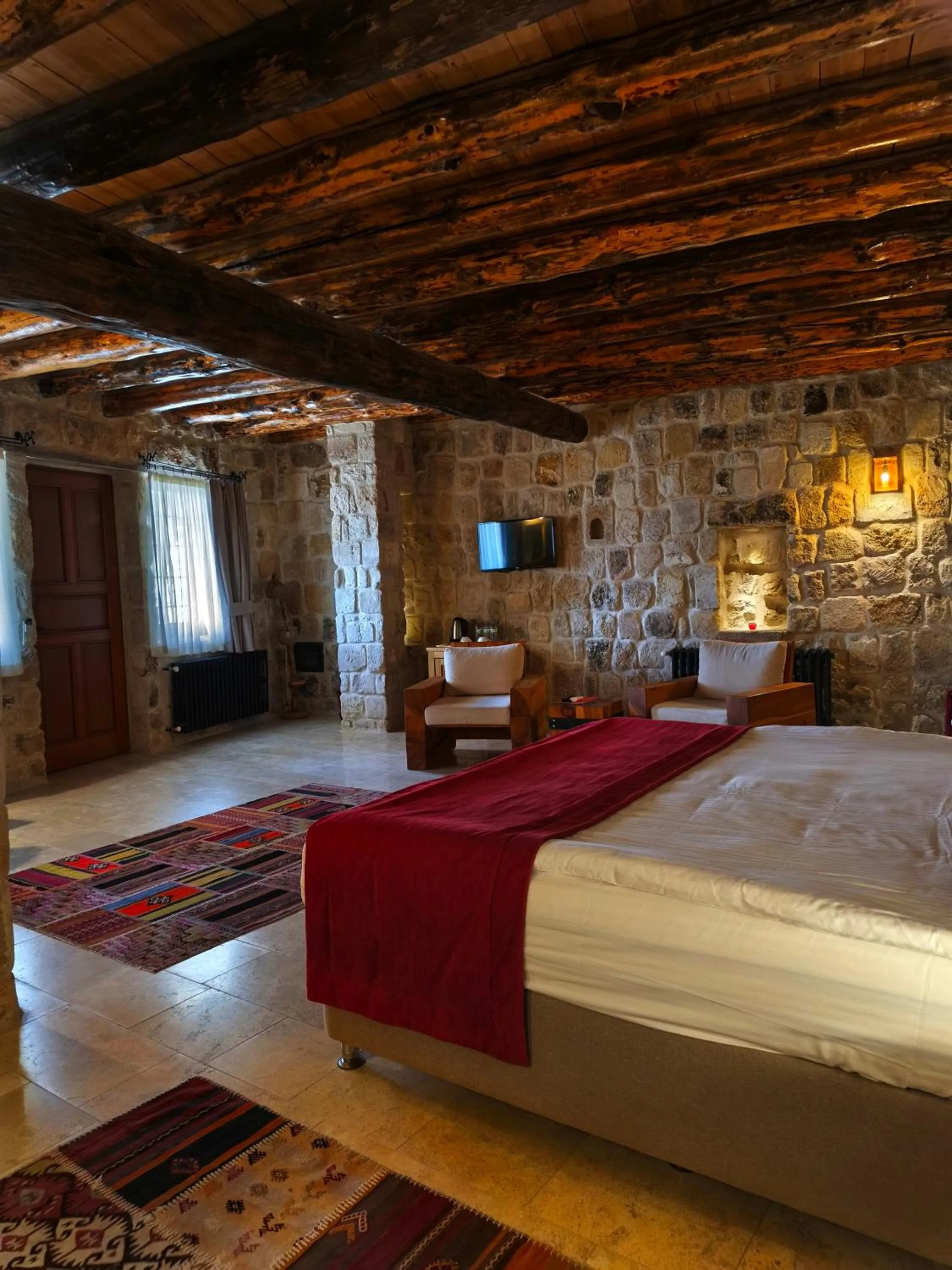 Bed in Acropolis Cave Suite