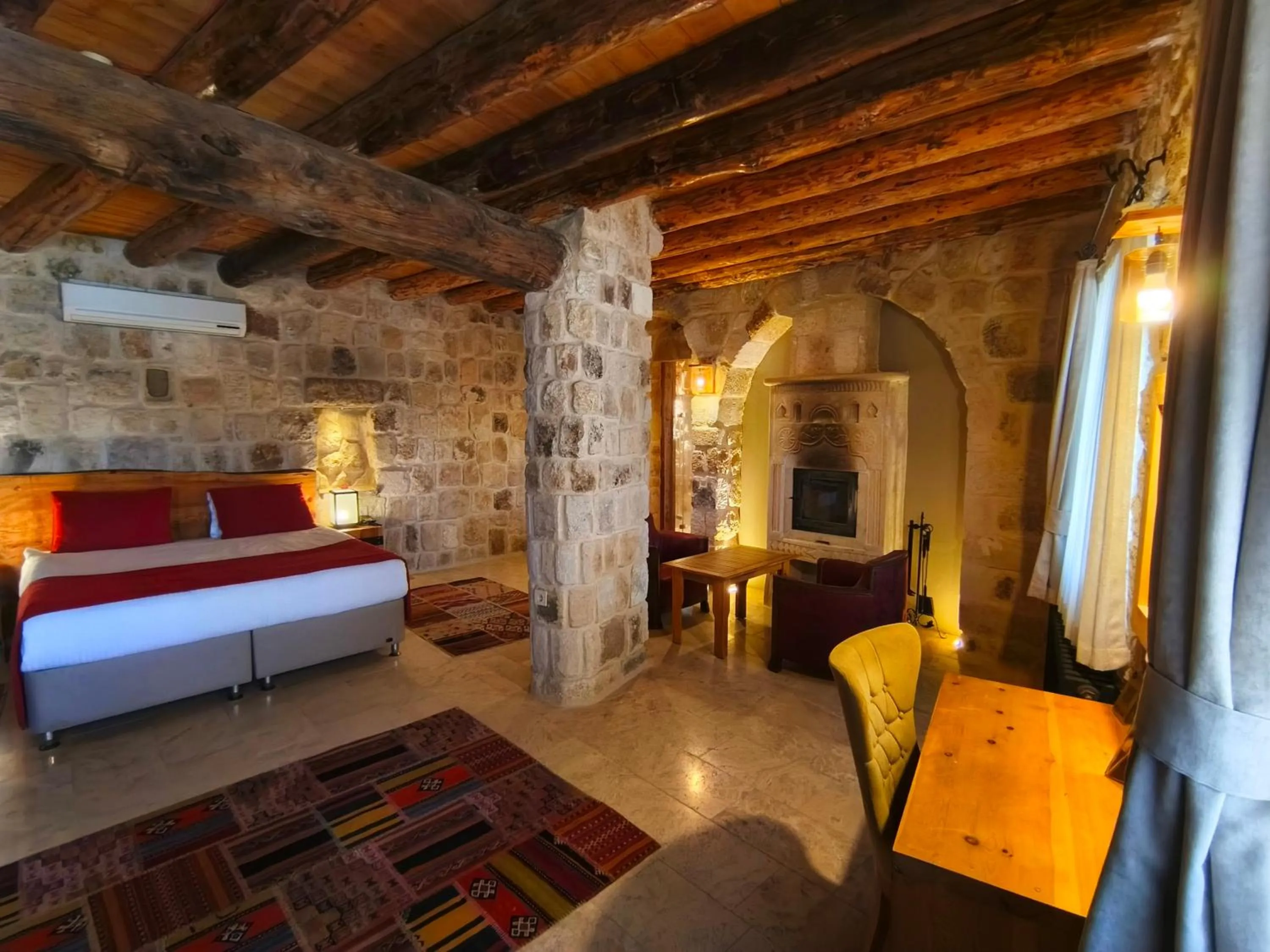Bed in Acropolis Cave Suite