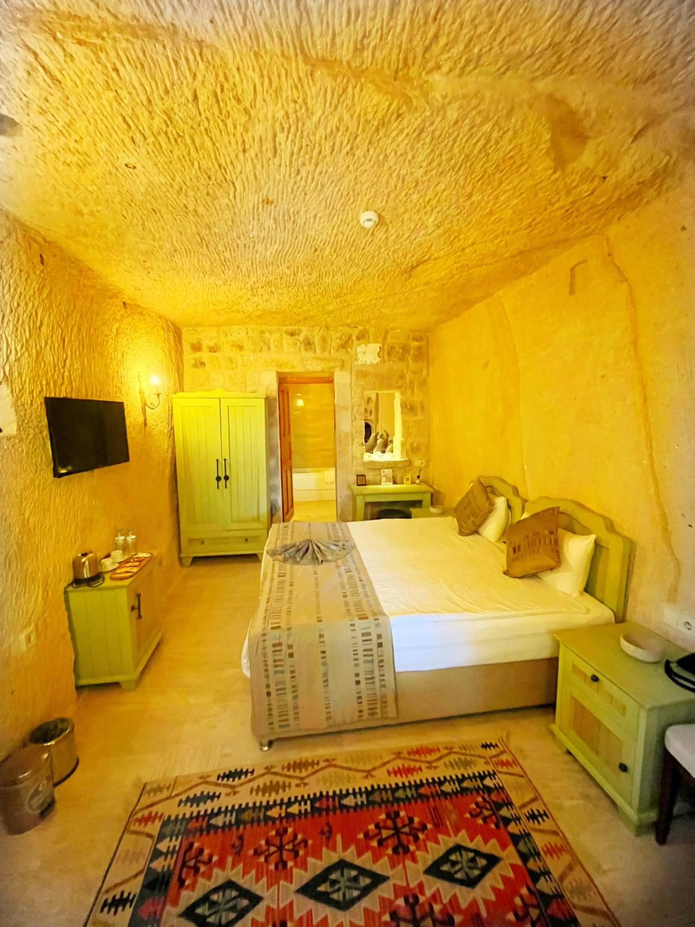 Photo of the whole room, Bed in Acropolis Cave Suite