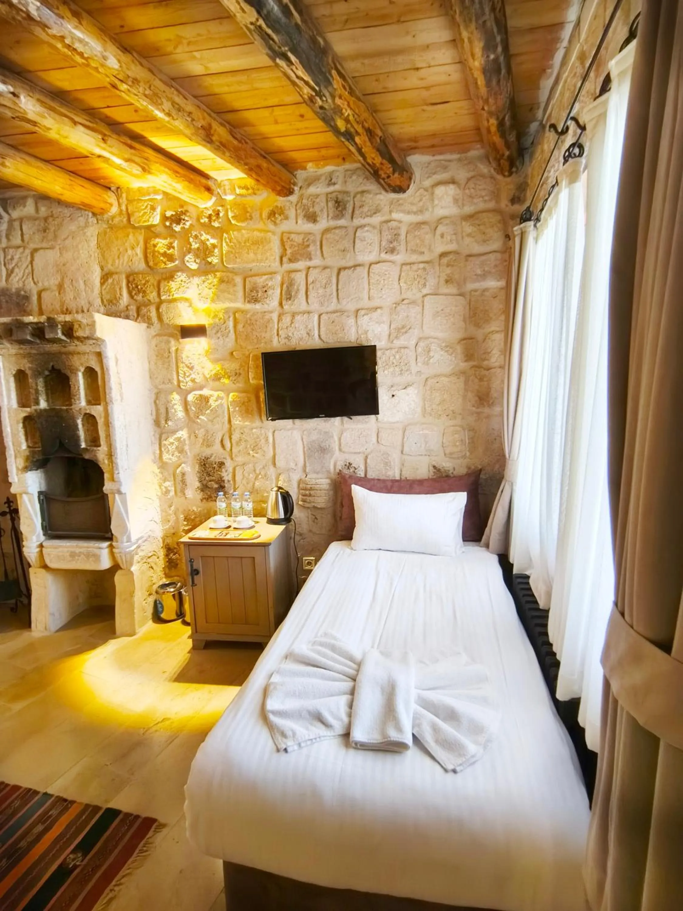 Bed in Acropolis Cave Suite