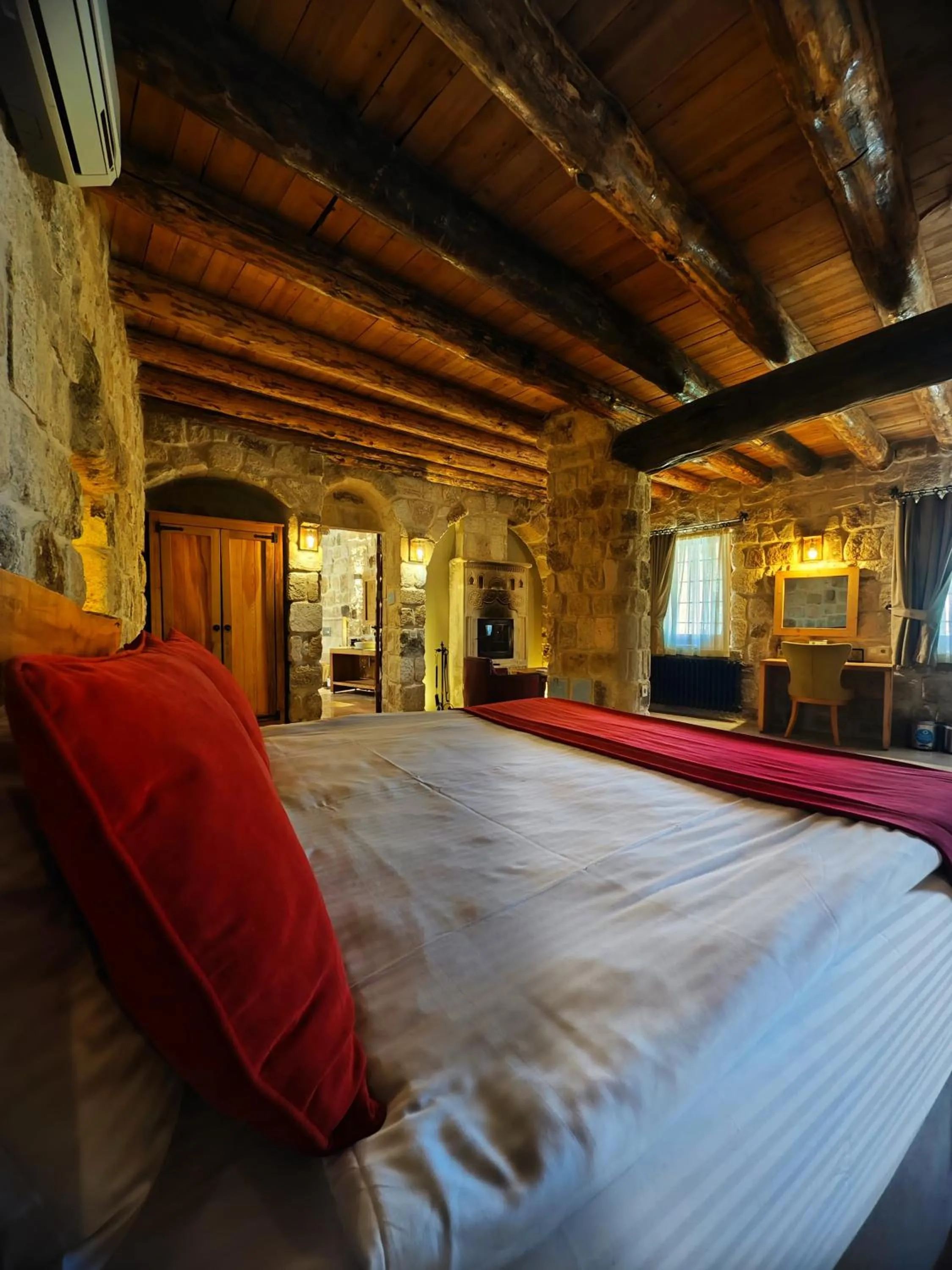 Bed in Acropolis Cave Suite