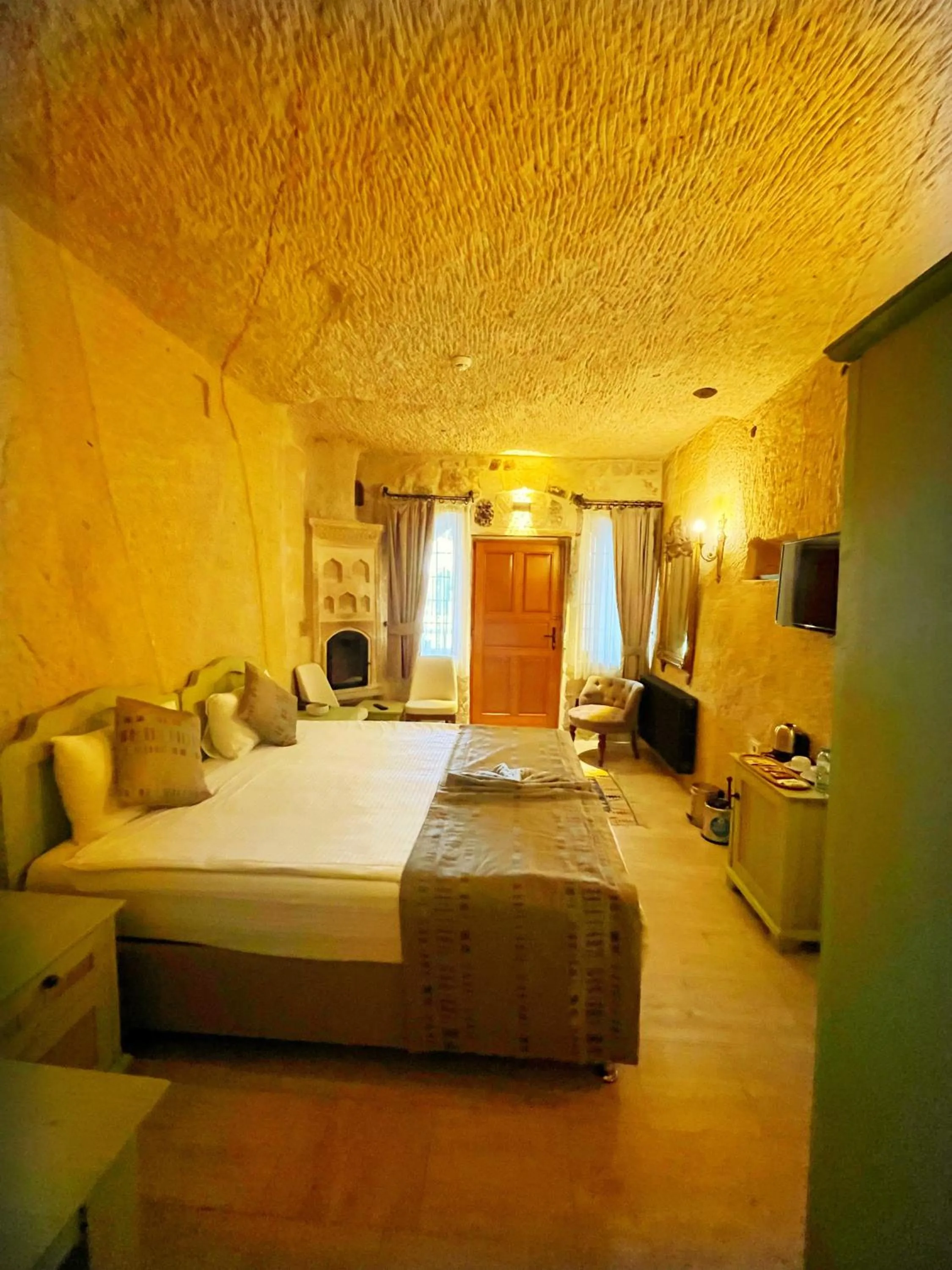 Photo of the whole room, Bed in Acropolis Cave Suite