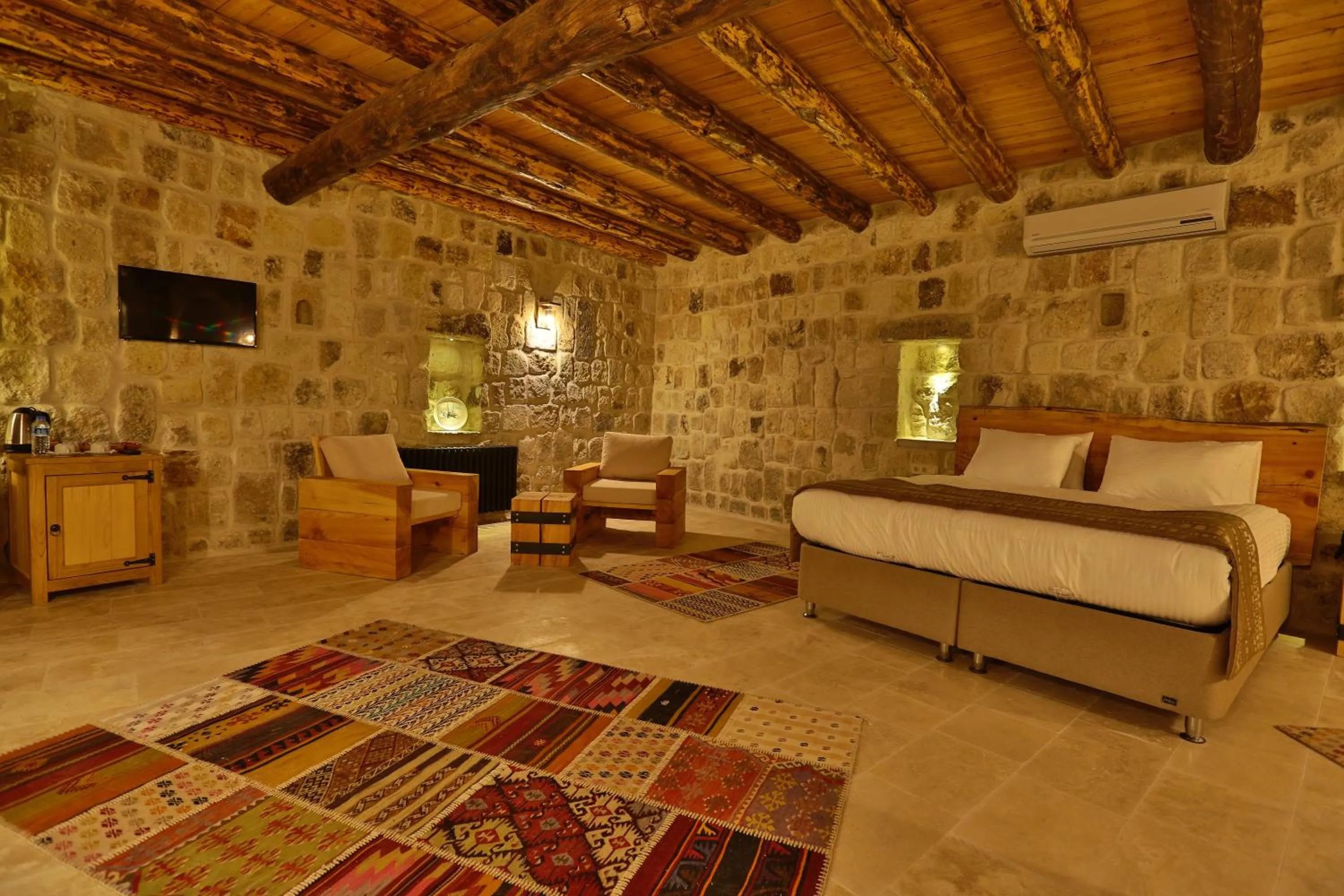 Bed in Acropolis Cave Suite