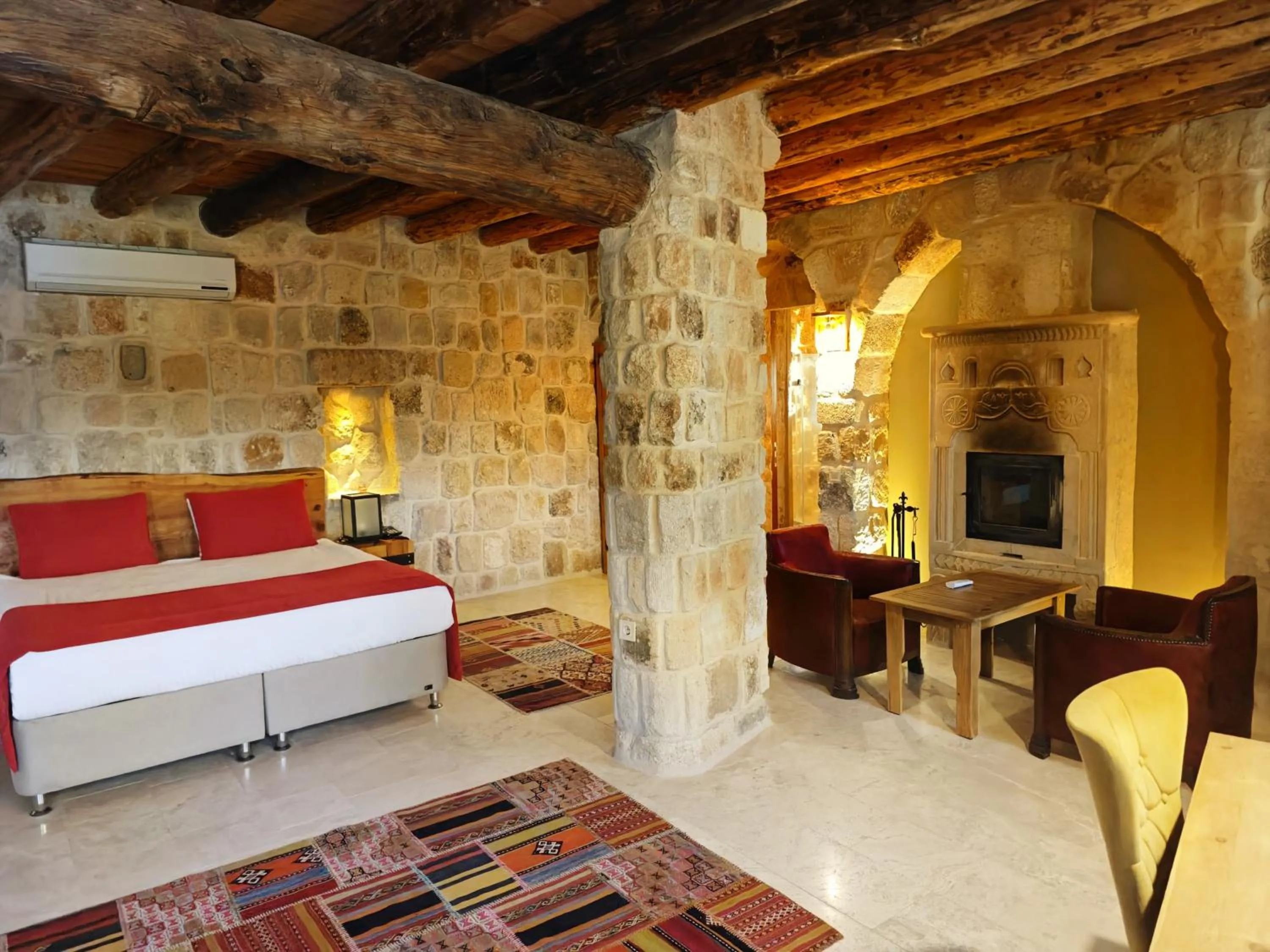 Bed in Acropolis Cave Suite