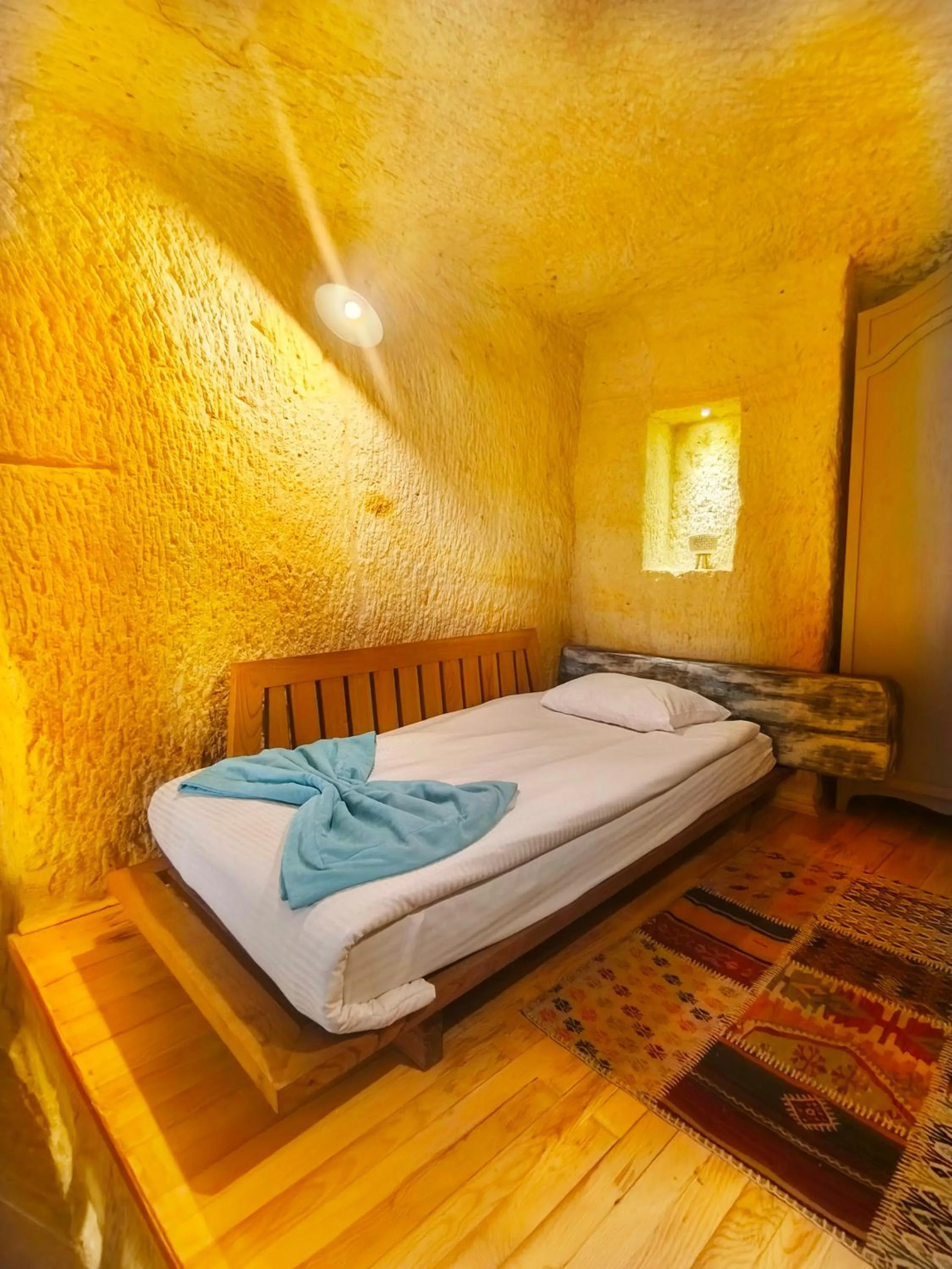 Bed in Acropolis Cave Suite
