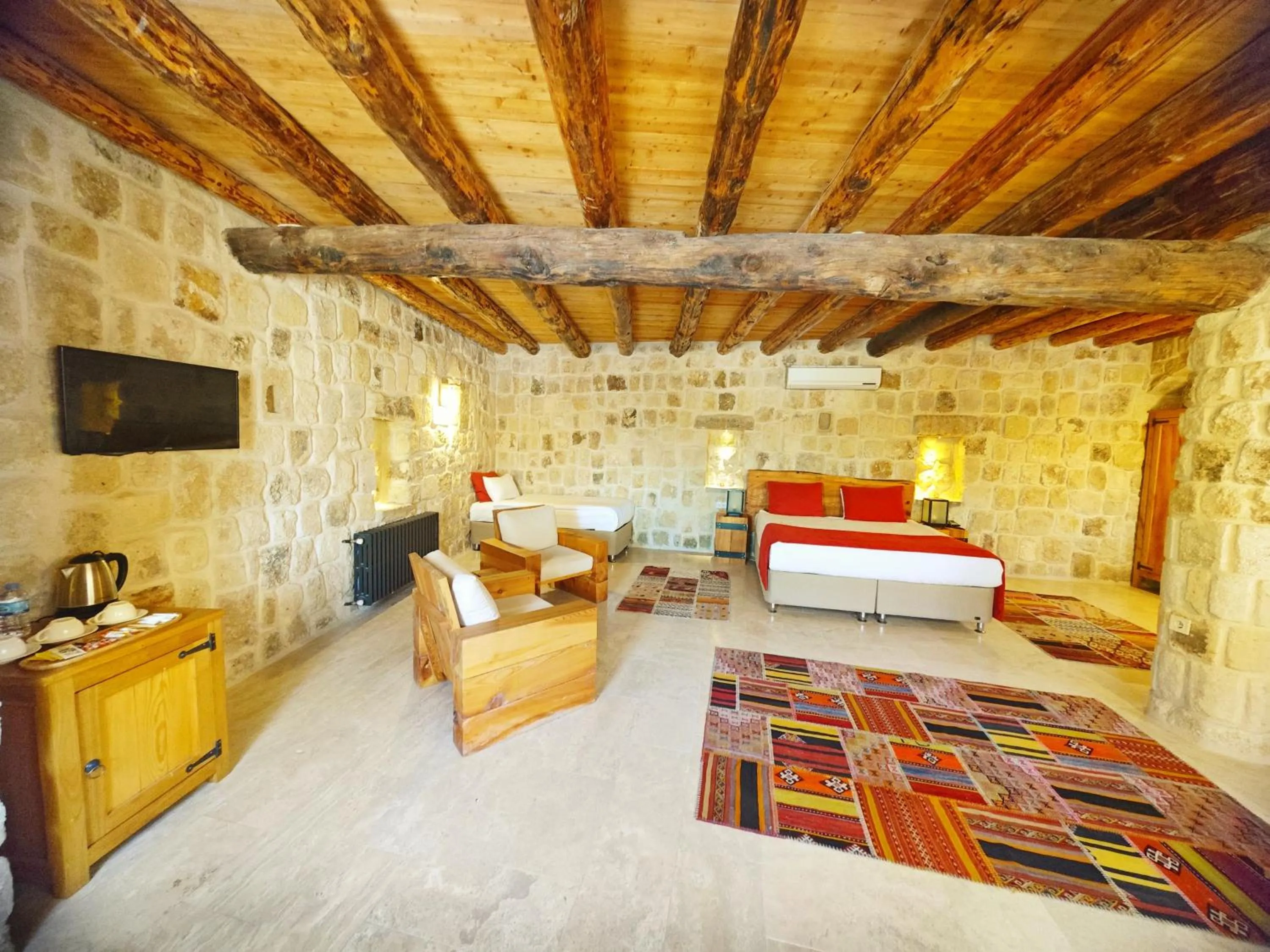 Bed in Acropolis Cave Suite