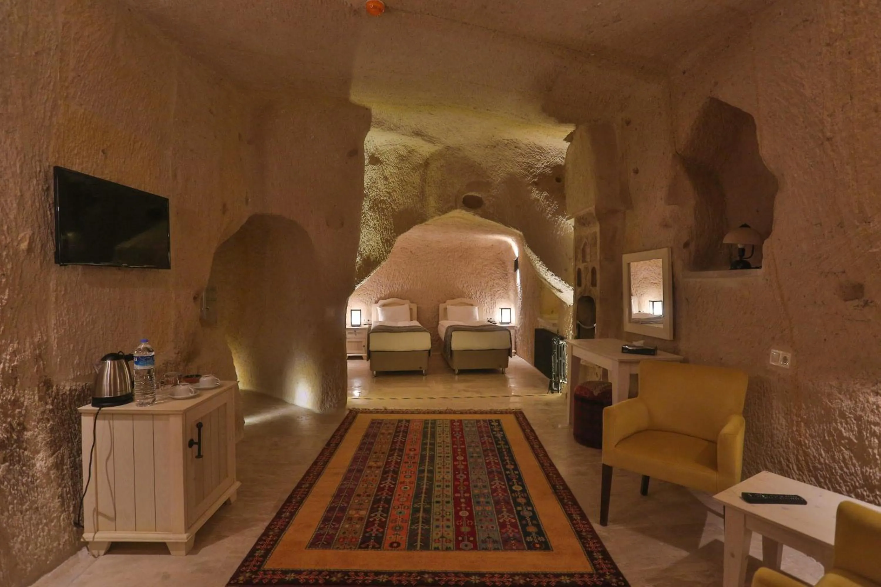 Bed in Acropolis Cave Suite