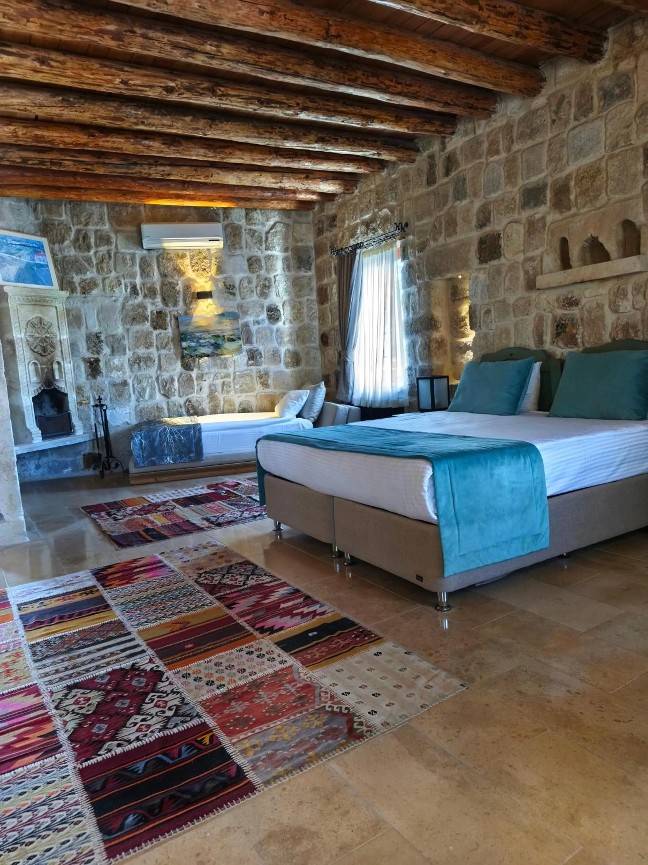 Bed in Acropolis Cave Suite