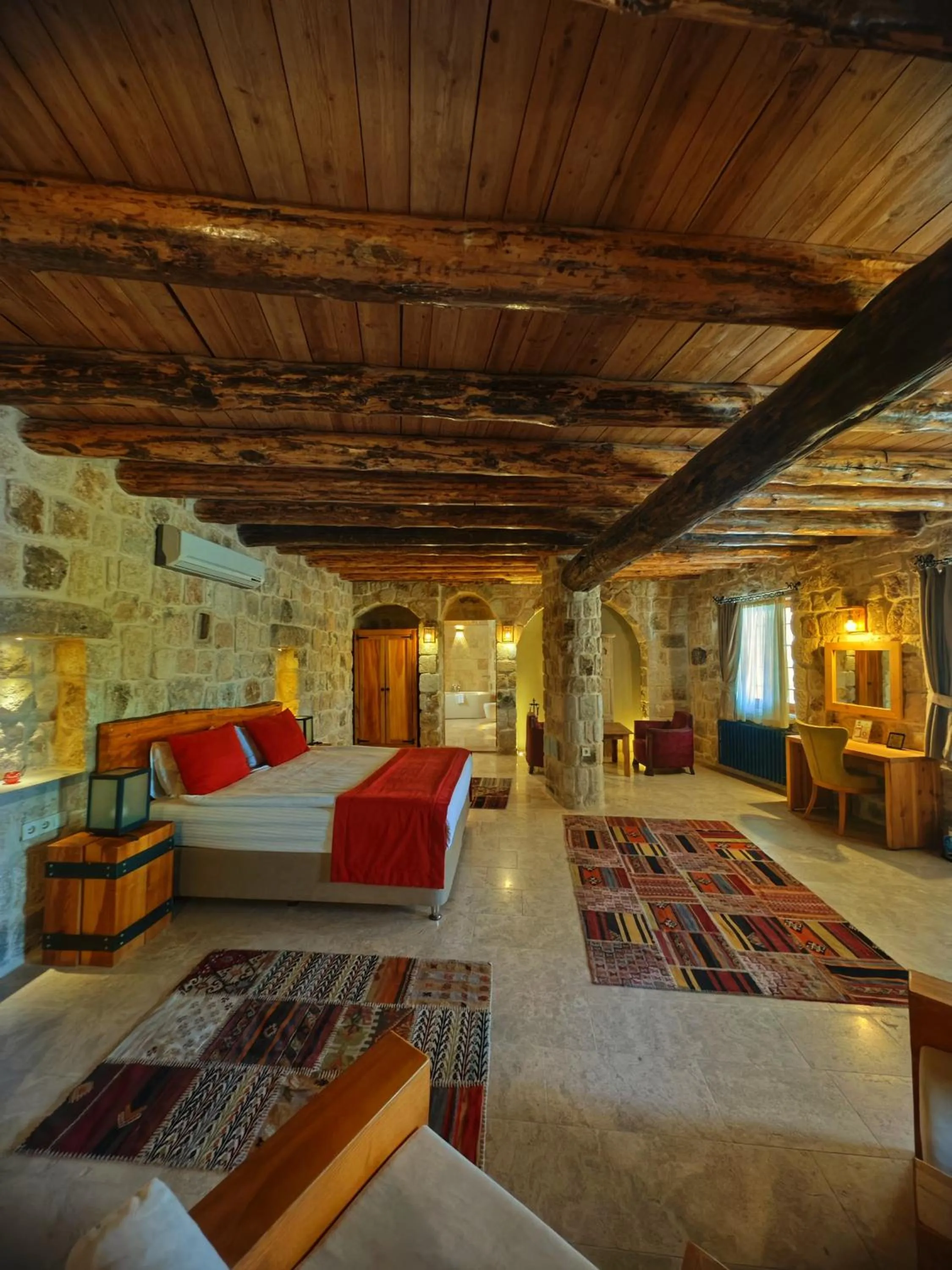 Bed in Acropolis Cave Suite