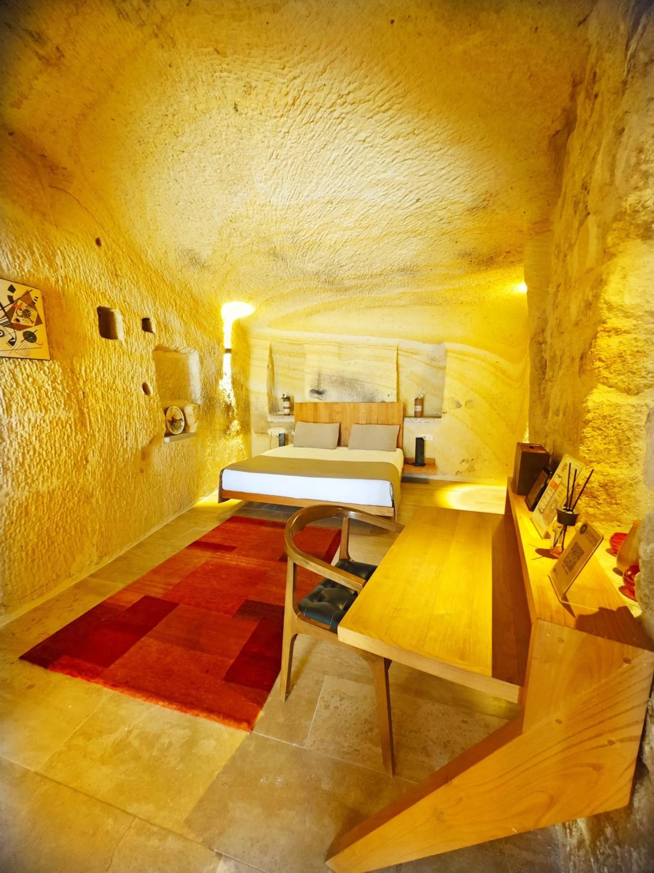 Bedroom in Acropolis Cave Suite