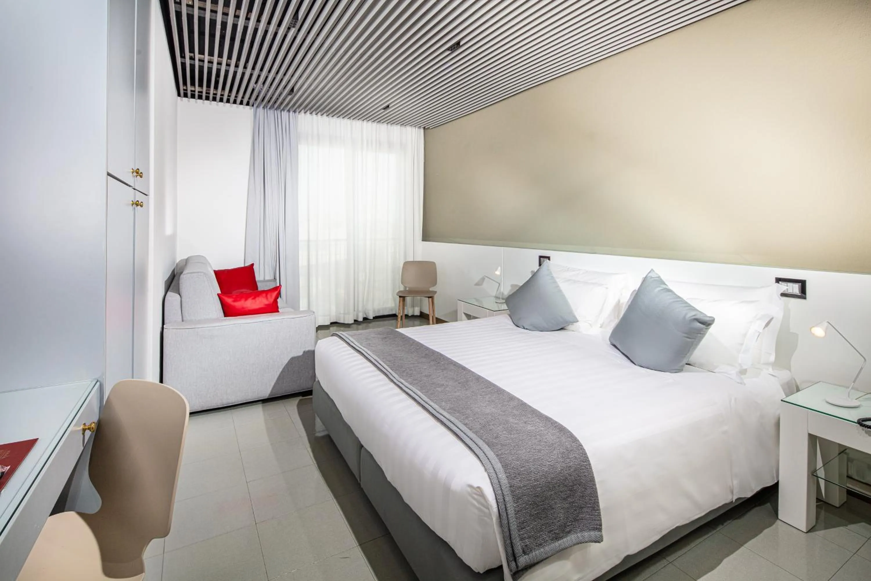 Bedroom in Monaco Suites Hotel