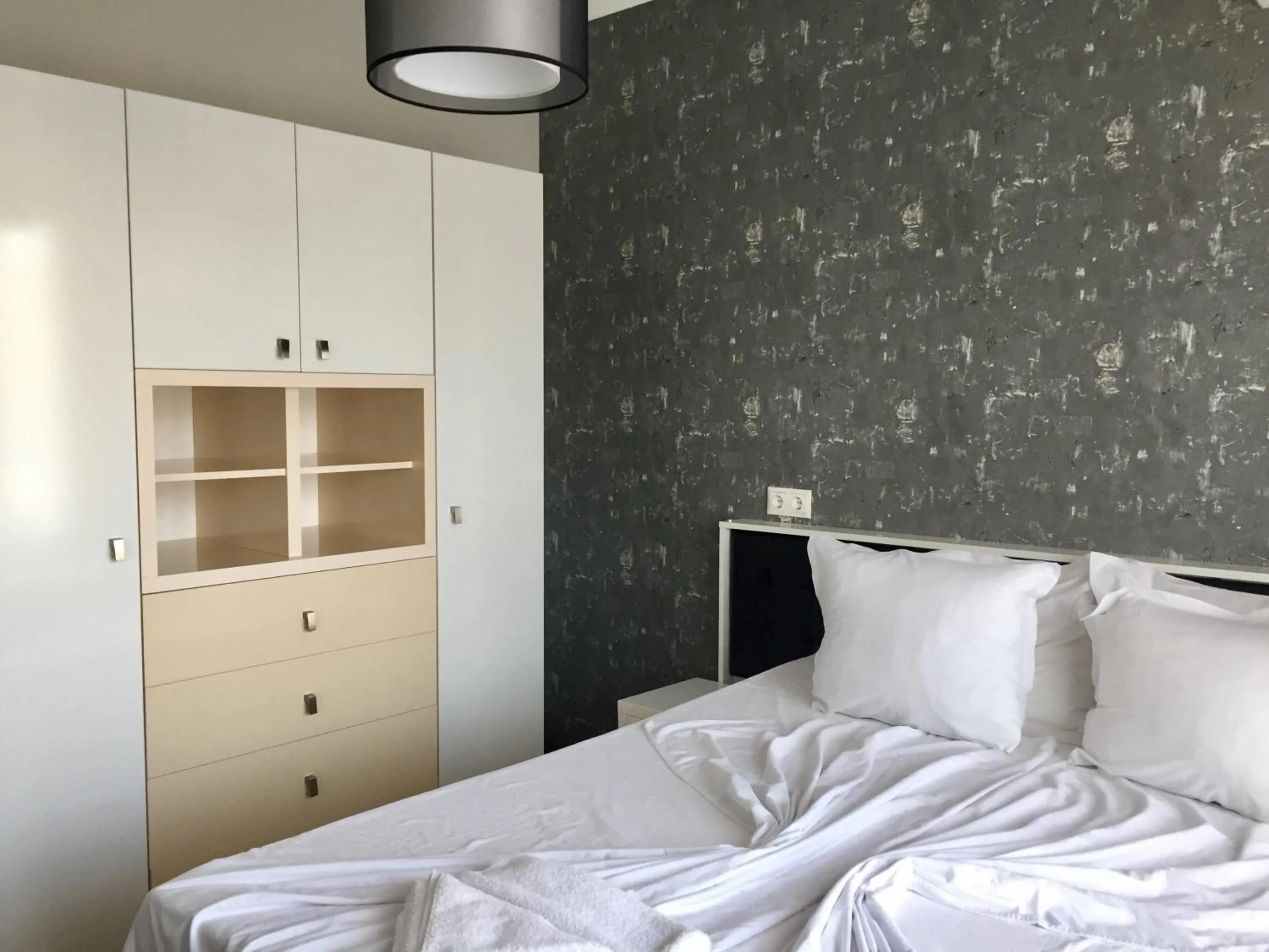 Bed in Green Paradise Deluxe Apartments