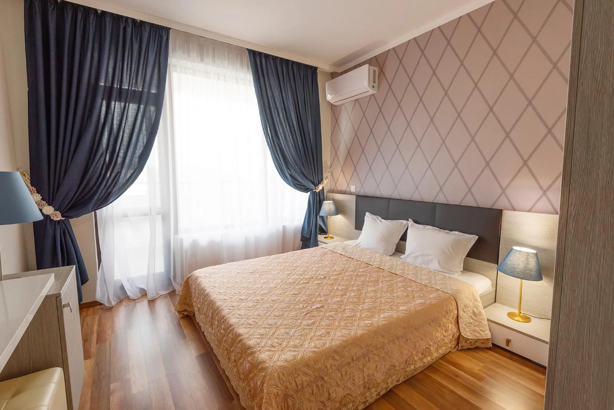 Bed in Green Paradise Deluxe Apartments
