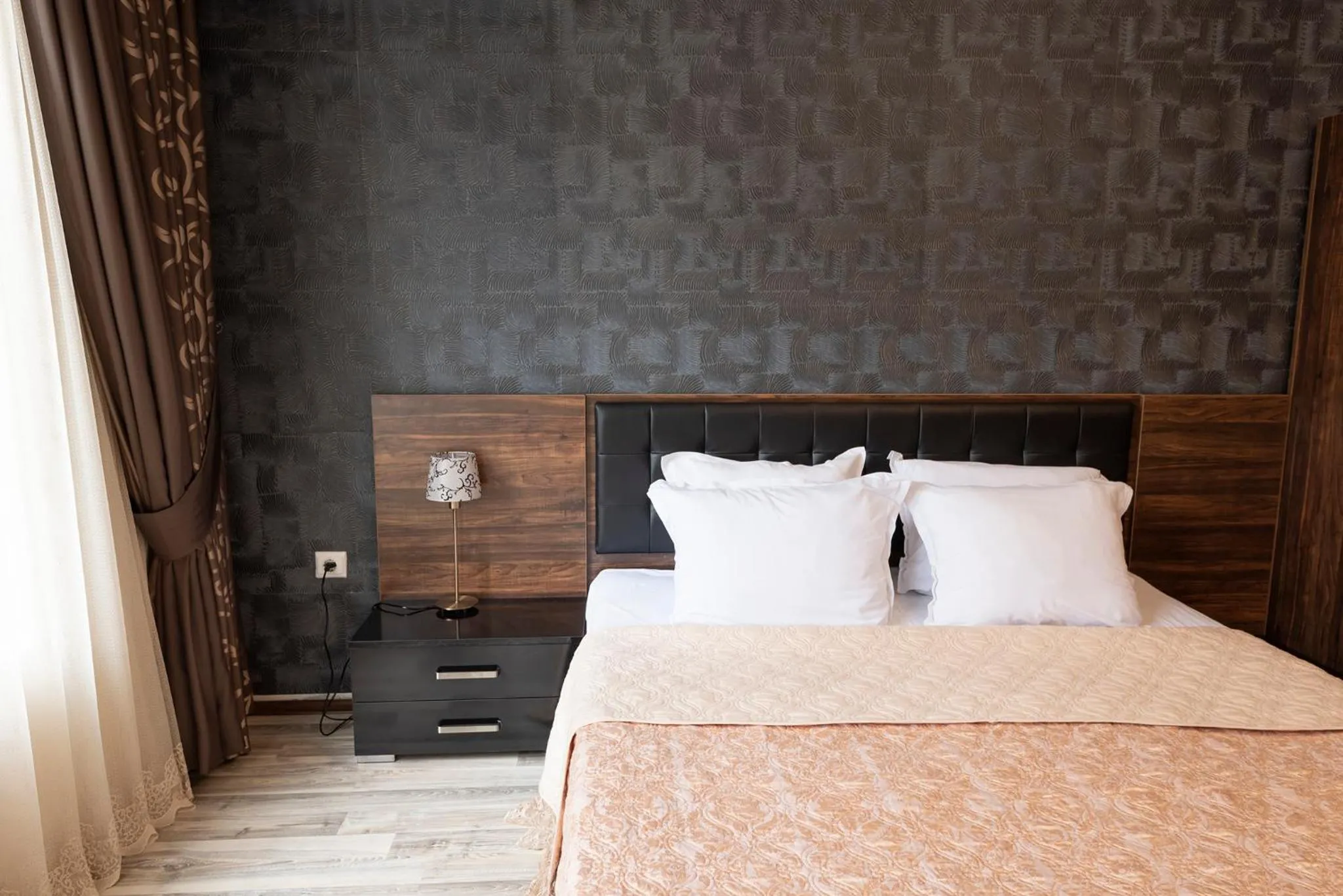 Bed in Green Paradise Deluxe Apartments