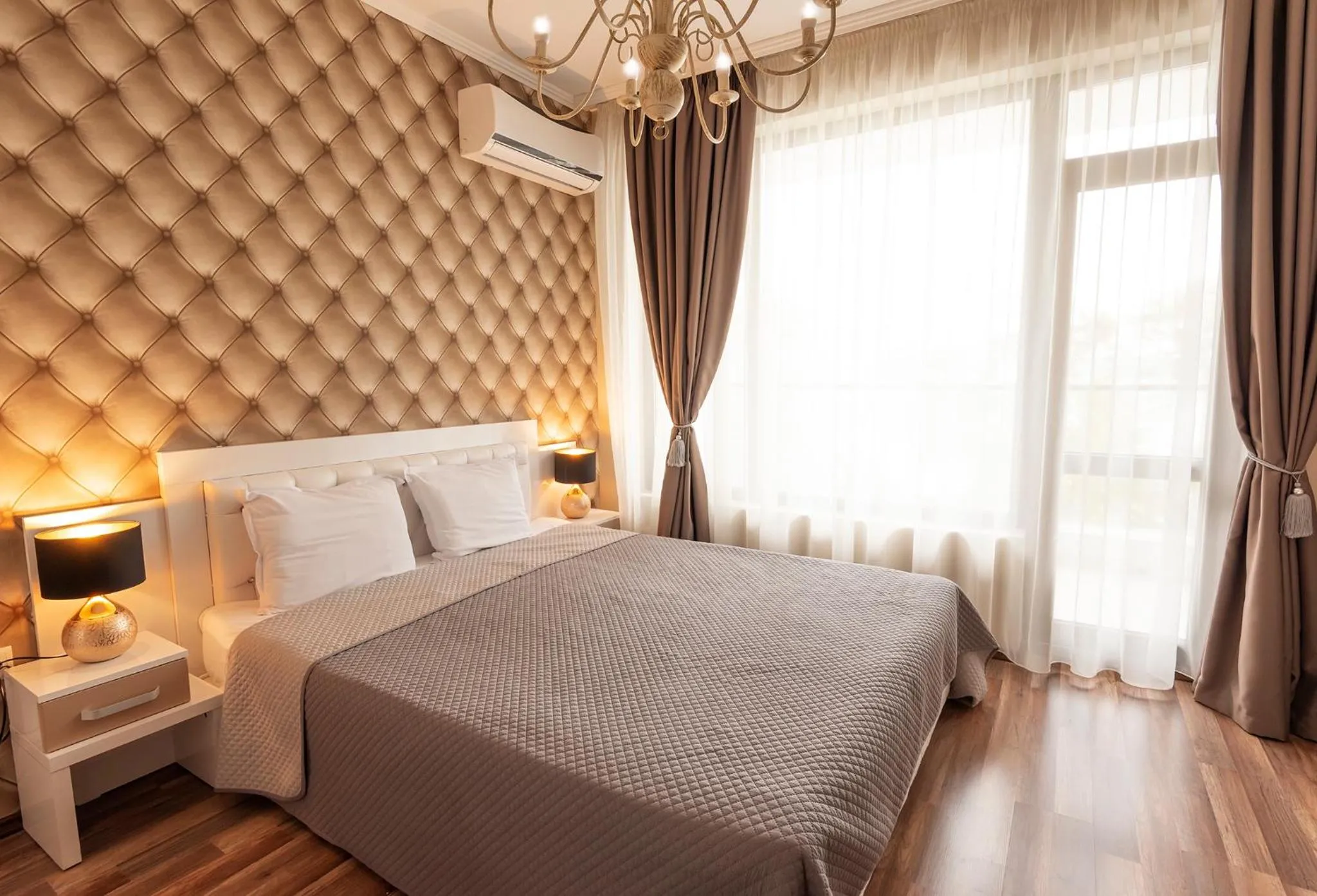 Bed in Green Paradise Deluxe Apartments
