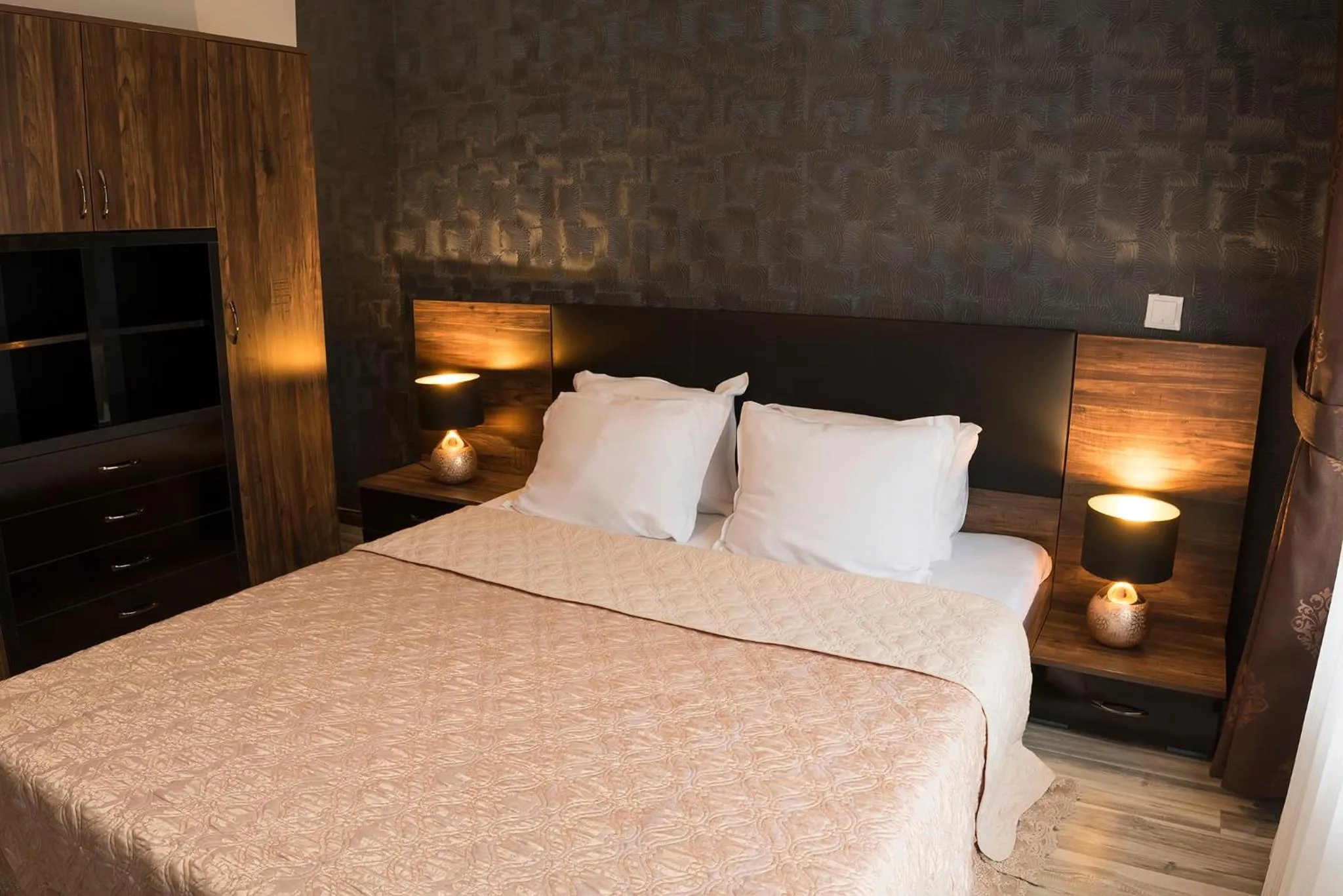 Bed in Green Paradise Deluxe Apartments